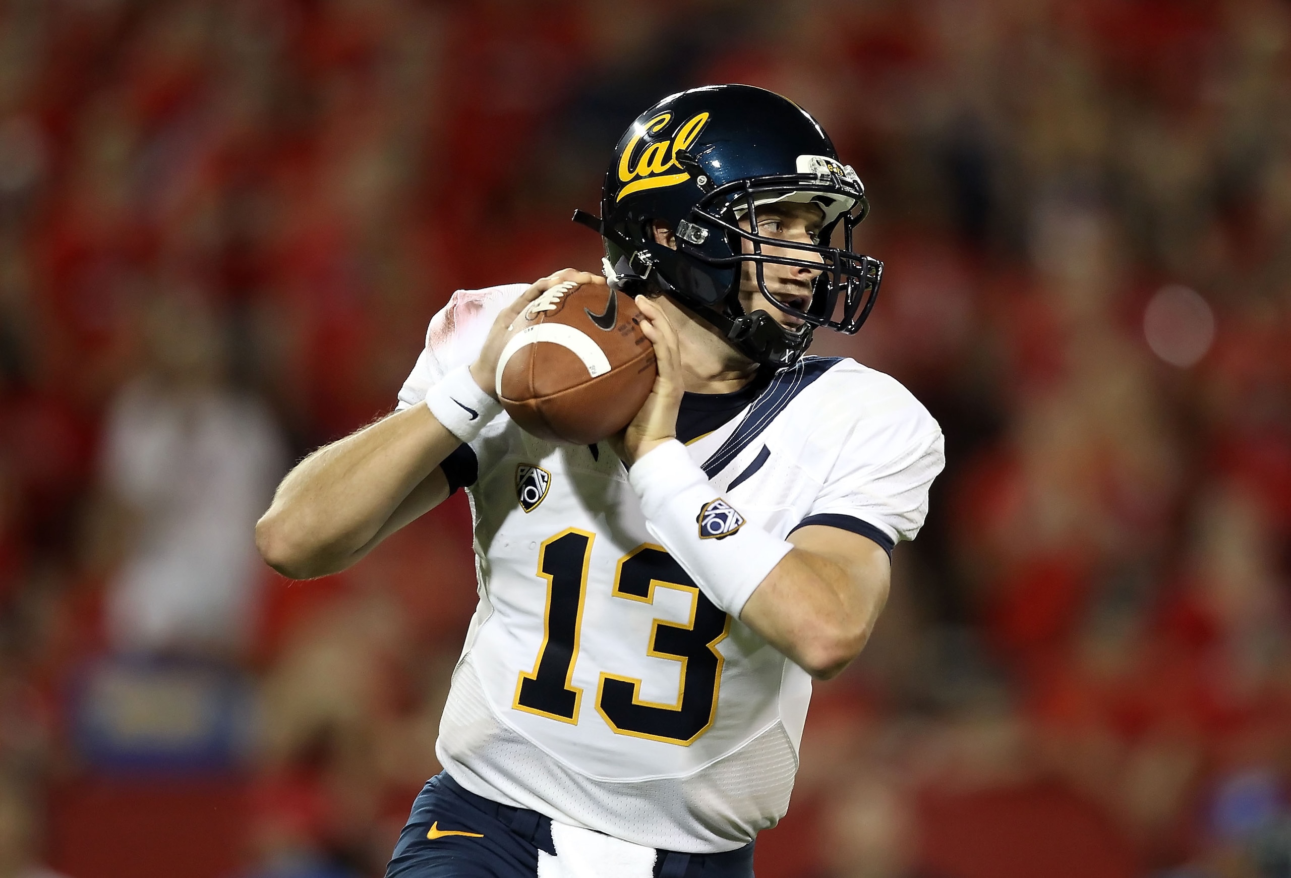 TUCSON, AZ - SEPTEMBER 25:  Quarterback Kevin Riley #13 of the California Golden Bears drops back to pass during the college football game against the Arizona Wildcats at Arizona Stadium on September 25, 2010 in Tucson, Arizona. The Wildcats defeated the