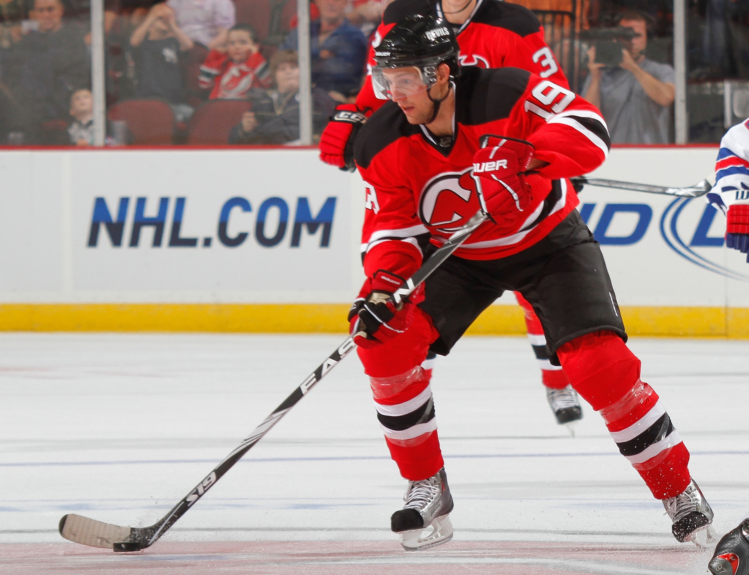 NEWARK, NJ - SEPTEMBER 25: Travis Zajac #19 of the New Jersey Devils during a preseason hockey game against the New York Rangers at the Prudential Center on September 25, 2010 in Newark, New Jersey.  (Photo by Paul Bereswill/Getty Images)