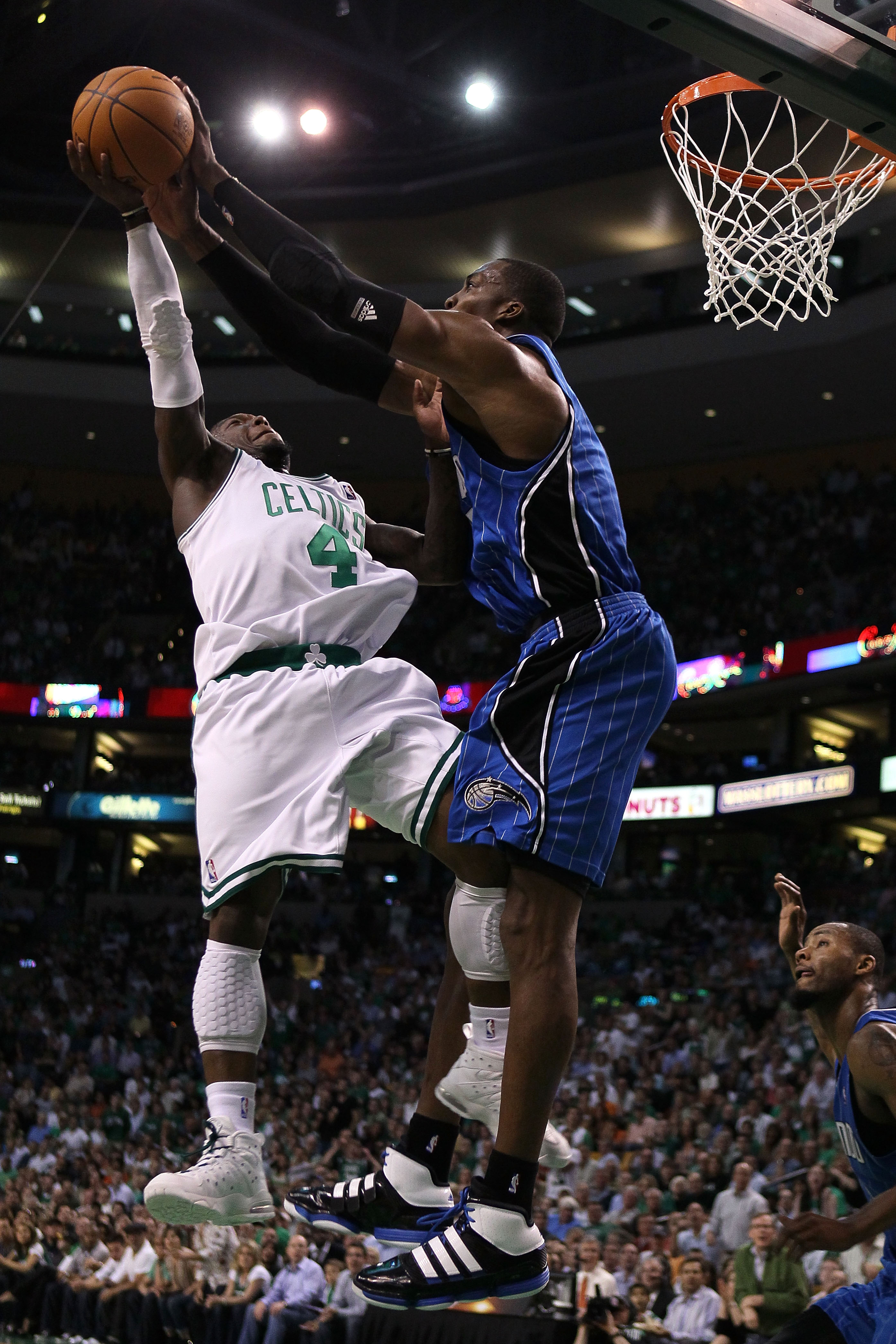 BOSTON - MAY 28:  Nate Robinson #4 of the Boston Celtics has his shot attempt blocked by Dwight Howard #12 of the Orlando Magic in Game Six of the Eastern Conference Finals during the 2010 NBA Playoffs at TD Garden on May 28, 2010 in Boston, Massachusetts