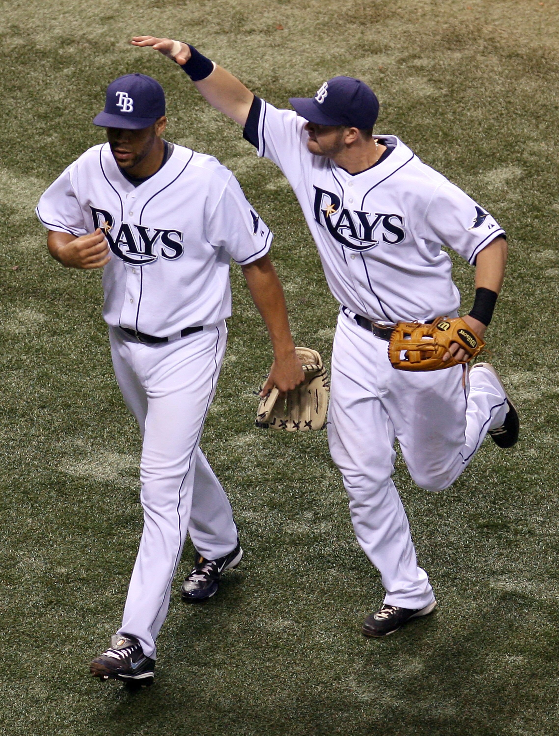 ST PETERSBURG, FL - OCTOBER 19:  Pitcher David Price #14 of the Tampa Bay Rays is congratulated by teammate Evan Longoria #3 after Price got out of the eighth inning of game seven of the American League Championship Series during the 2008 MLB playoffs on