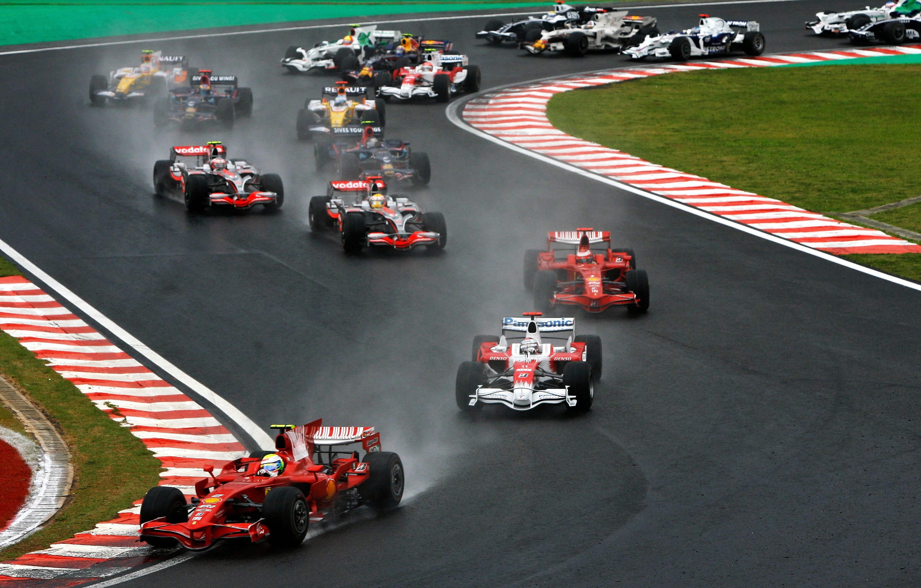 SAO PAULO, BRAZIL - NOVEMBER 02:  Felipe Massa of Brazil and Ferrari leads from Jarno Trulli of Italy and Toyota, Kimi Raikkonen of Finland and Ferrari and Lewis Hamilton of Great Britain and McLaren Mercedes at the start of the Brazilian Formula One Gran