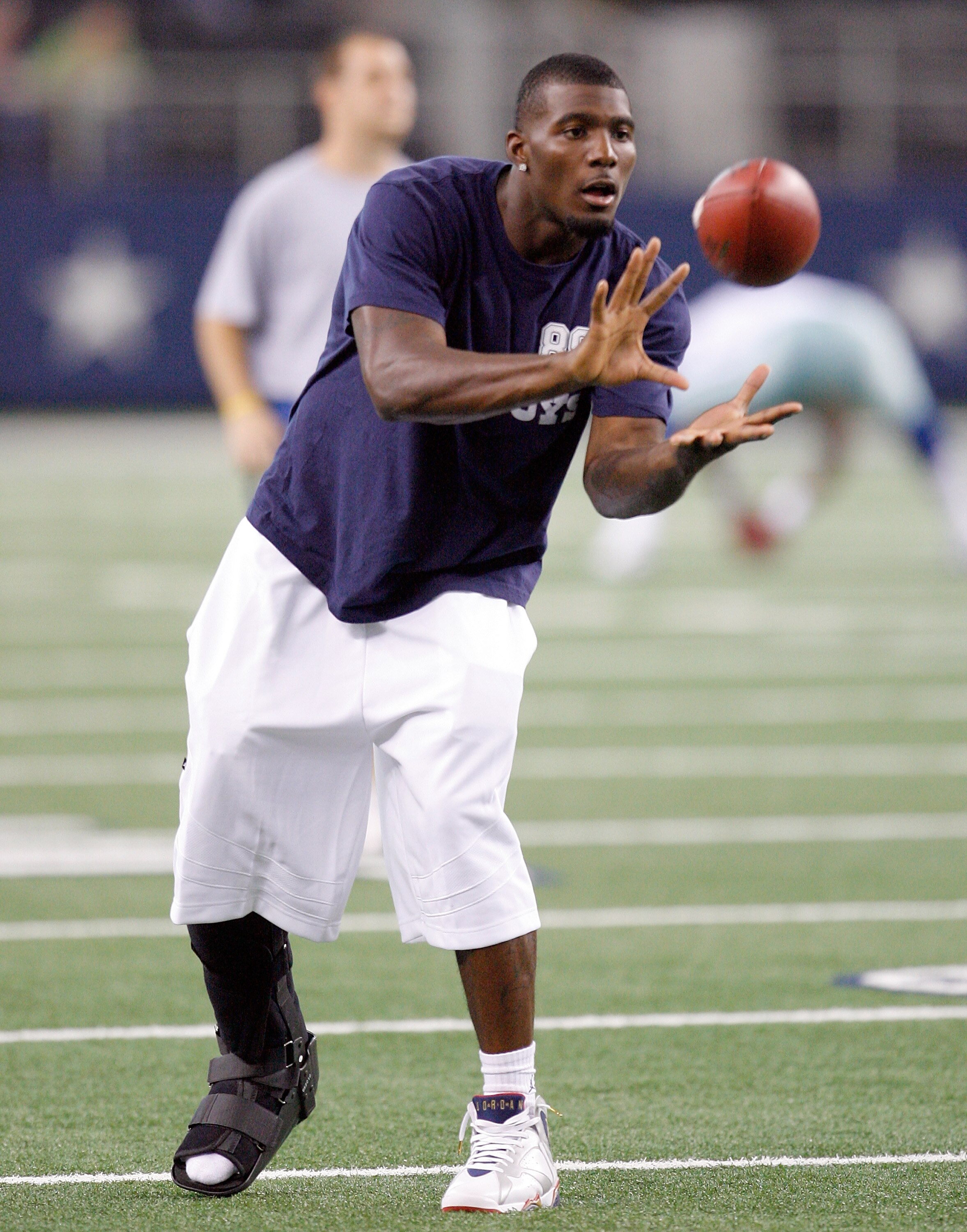 ARLINGTON, TX - AUGUST 12:  Dez Bryant #88 of the Dallas Cowboys catches a pass during pregame warm-up before the preseason game against the Oakland Raiders at Dallas Cowboys Stadium on August 12, 2010 in Arlington, Texas.  Bryant suffered a high-ankle sp
