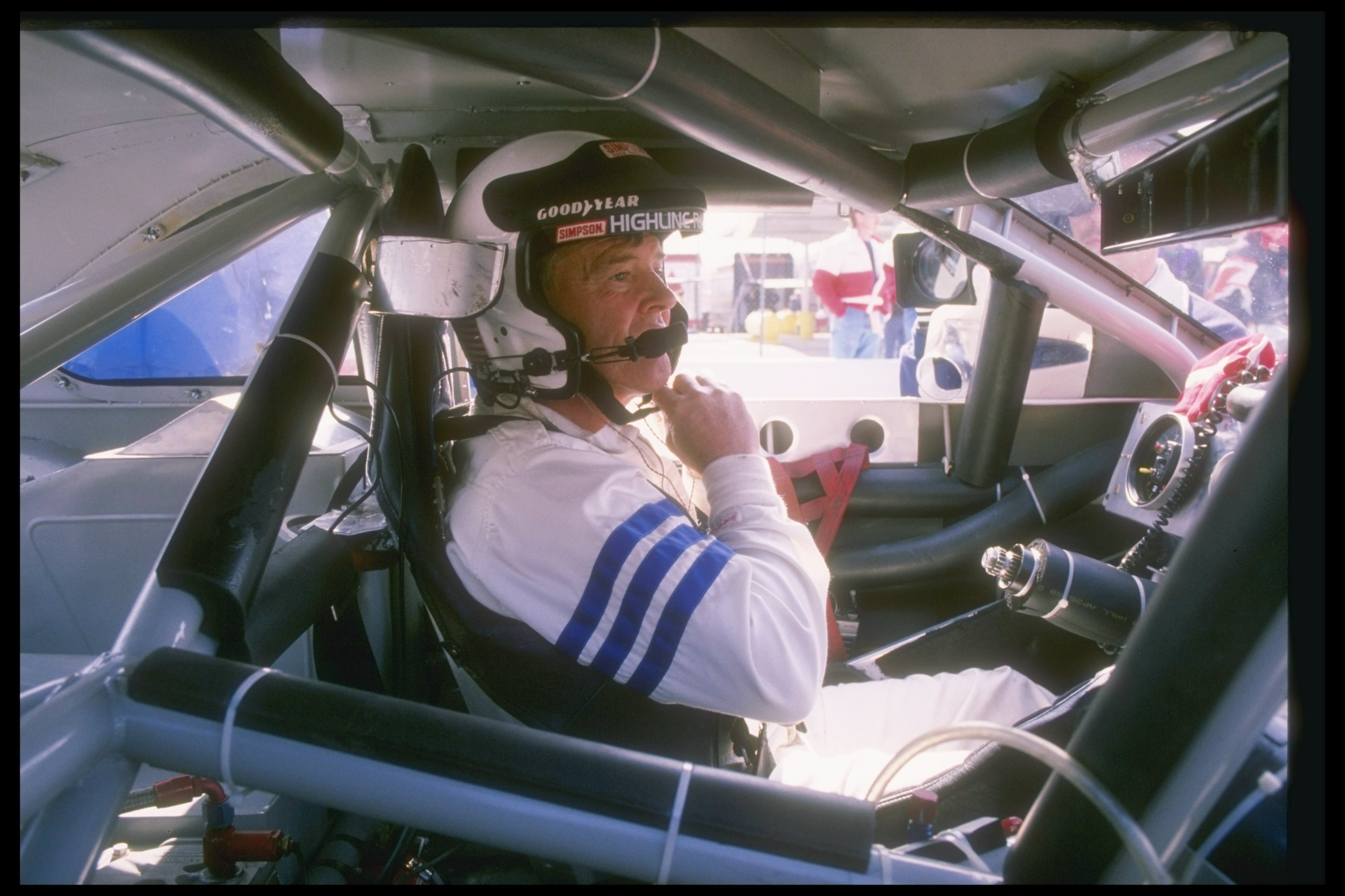 Dick Trickle sits in his car before the start of a NASCAR race. Dick Trickle sits in his car before the start of a NASCAR race.