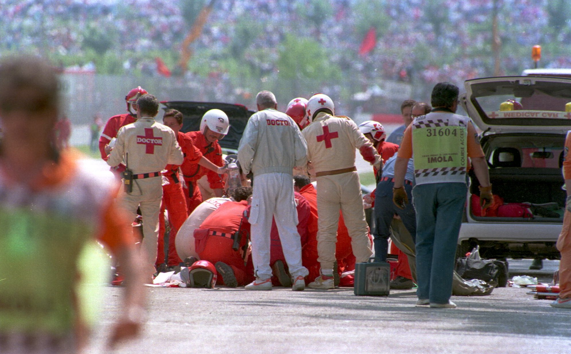 1 MAY 1994: AYRTON SENNA OF BRAZIL IS ATTENDED TO BY MEDICS  ON THE TRACK AFTER HE CRASHED INTO THE CONCRETE BARRIER WITH HIS ROTHMANS WILLIAMS CAR DURING THE EARLY STAGES OF TEH SAN MARINO FORMULA ONE GRAND PRIX AT IMOLA. SENNA SUSTAINED SERIOUS HEAD INJ