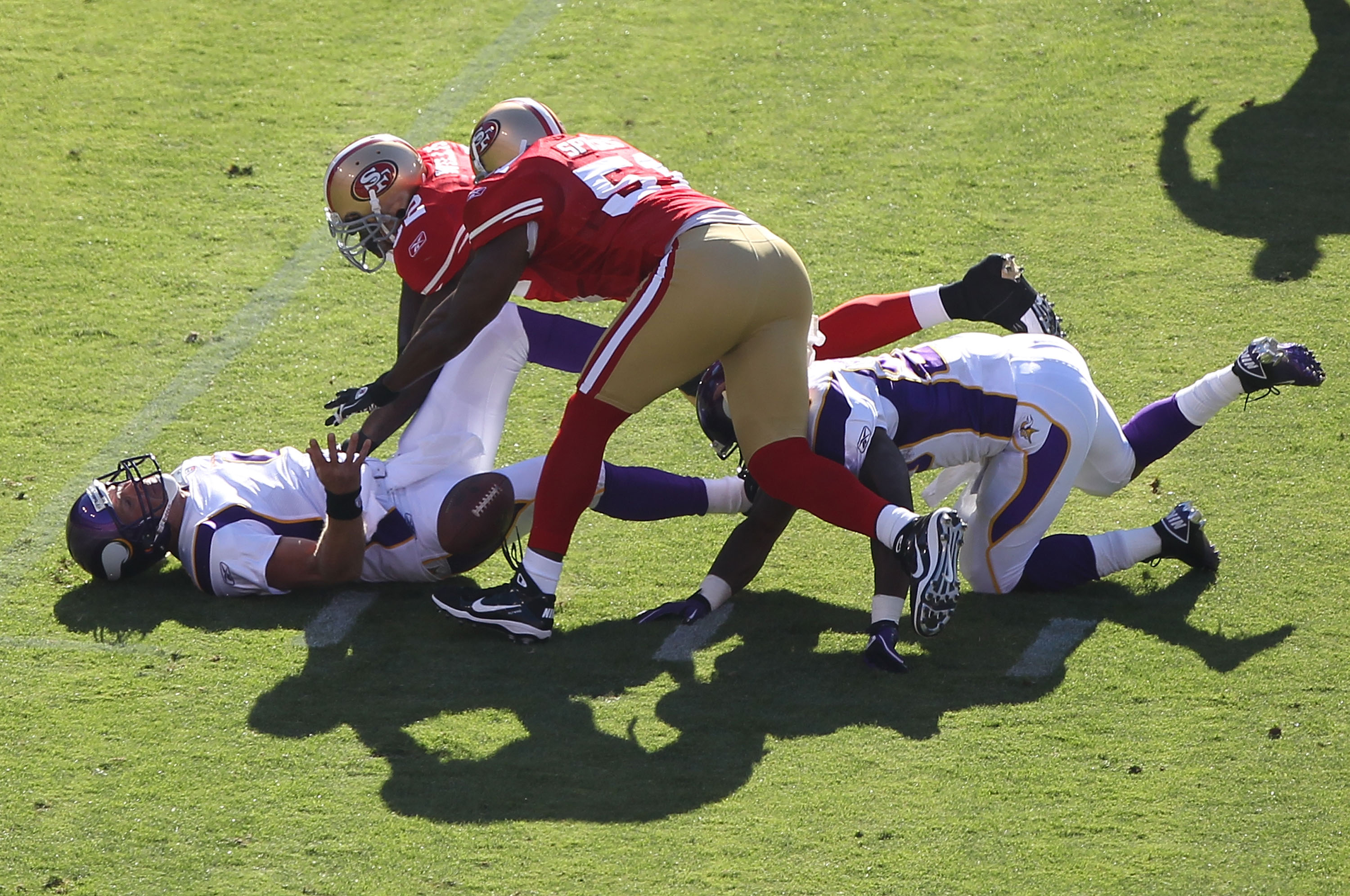 SAN FRANCISCO - AUGUST 22: Brett Favre #4 of the Minnesota Vikings is sacked by Patrick Willis #52 and Takeo Spikes #51 of the San Francisco 49ers during an NFL pre-season game at Candlestick Park on August 22, 2010 in San Francisco, California. (Photo SAN FRANCISCO - AUGUST 22: Brett Favre #4 of the Minnesota Vikings is sacked by Patrick Willis #52 and Takeo Spikes #51 of the San Francisco 49ers during an NFL pre-season game at Candlestick Park on August 22, 2010 in San Francisco, California. (Photo