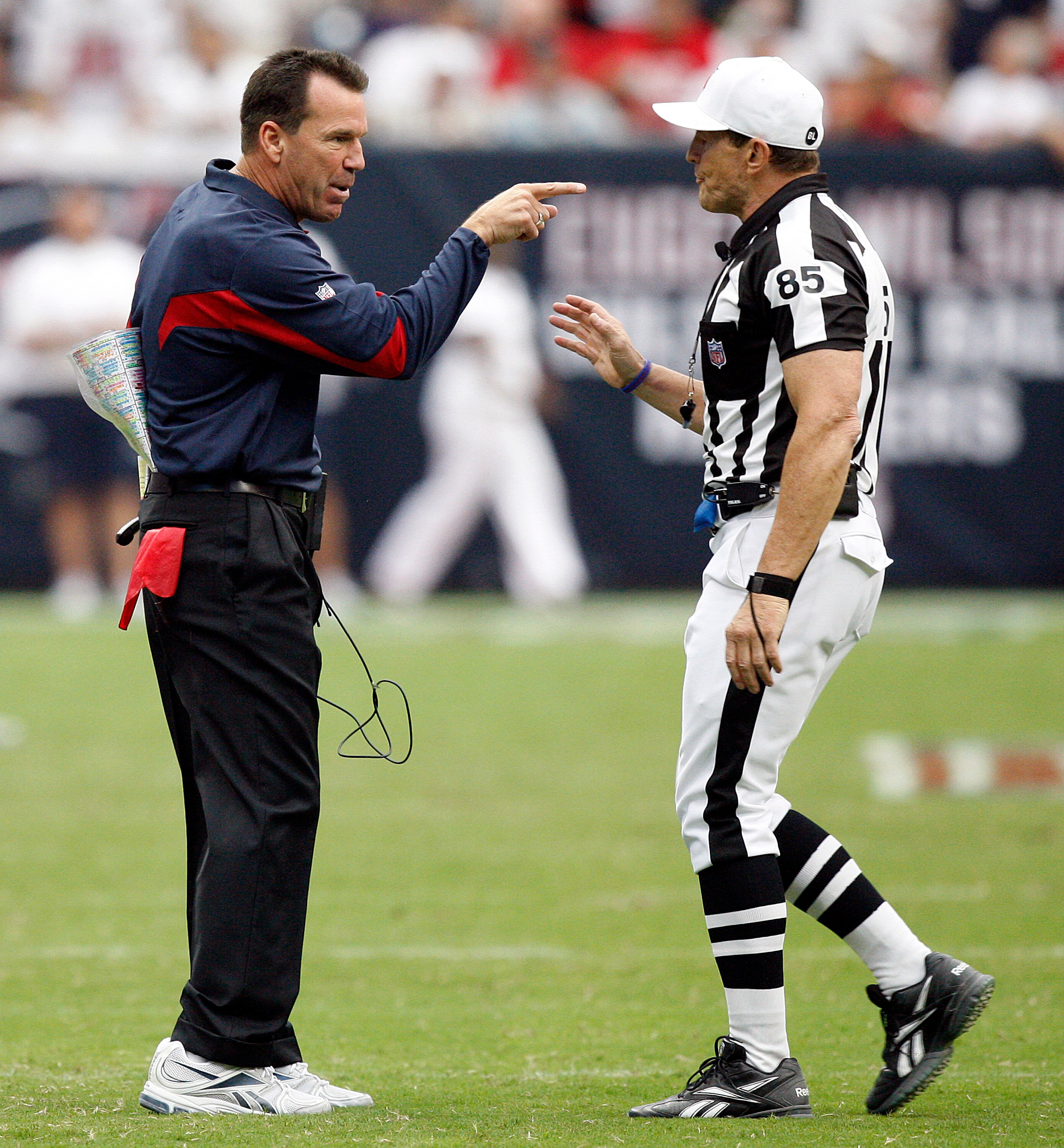 HOUSTON - SEPTEMBER 12:  Houston Texans head coach Gary Kubiak has words with referee Ed Hochuli after the Texans were charged with a timeout after the play clock was zero against the indianapolis Colts during the NFL season opener at Reliant Stadium on S