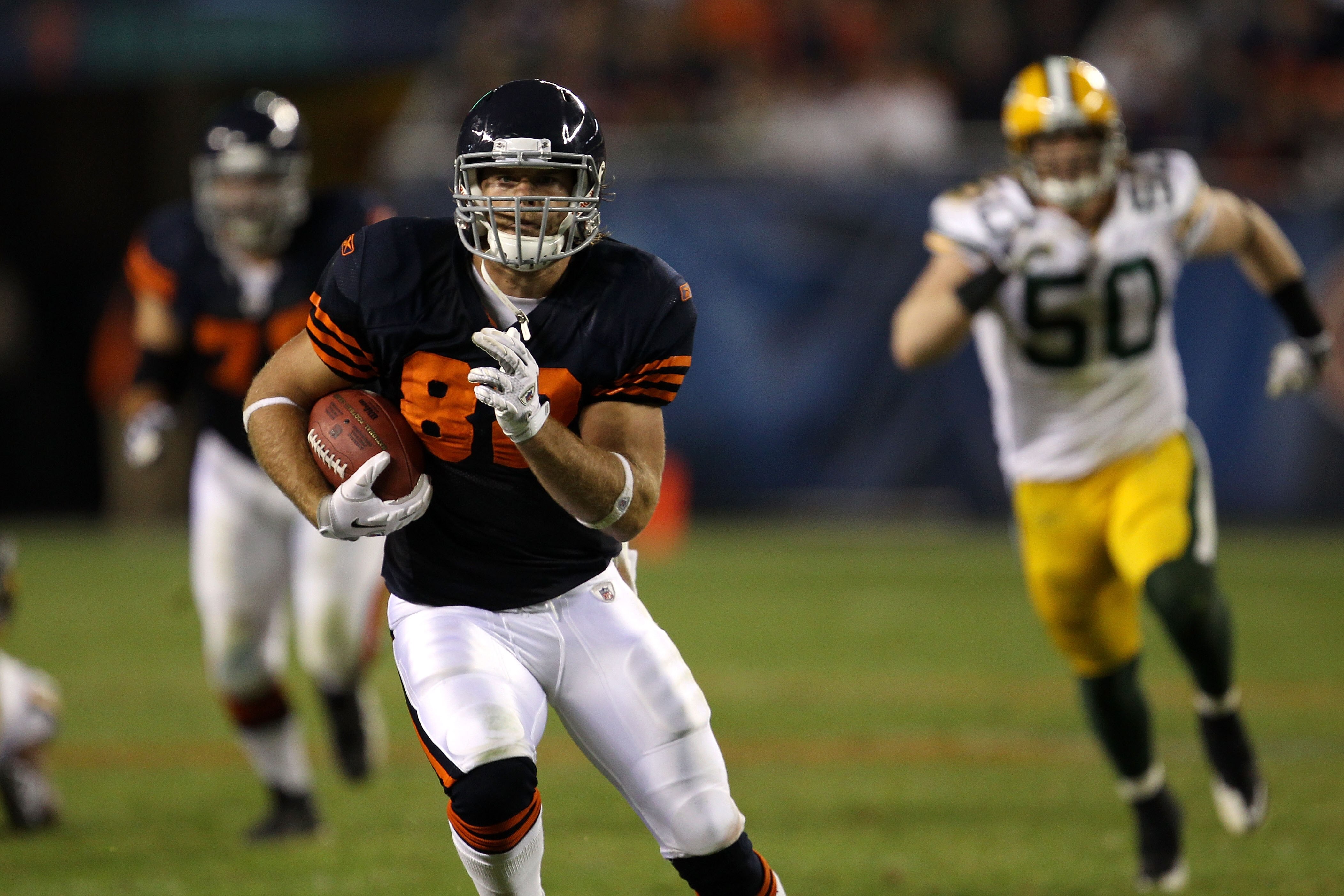 CHICAGO - SEPTEMBER 27:  Greg Olsen #82 of the Chicago Bears runs for yards after the catch against A.J. Hawk #50 of the Green Bay Packers at Soldier Field on September 27, 2010 in Chicago, Illinois. The Bears won 20-17.  (Photo by Jonathan Daniel/Getty I