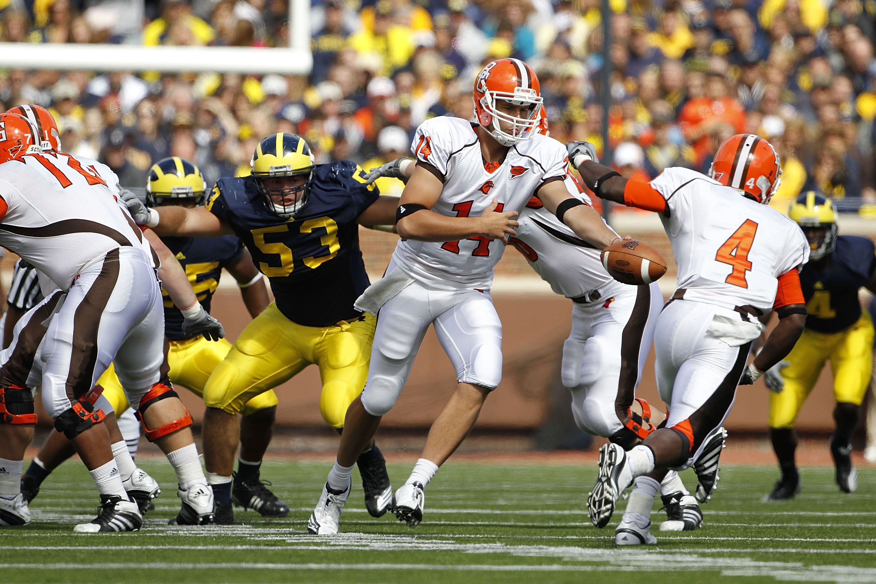 ANN ARBOR, MI - SEPTEMBER 25:  Aaron Pankratz #14 of Bowling Green hands the ball off to Jordan Hopgood #4 during the second quarter of the game against the Michigan Wolverines on September 25, 2010 at Michigan Stadium in Ann Arbor, Michigan. Michigan def