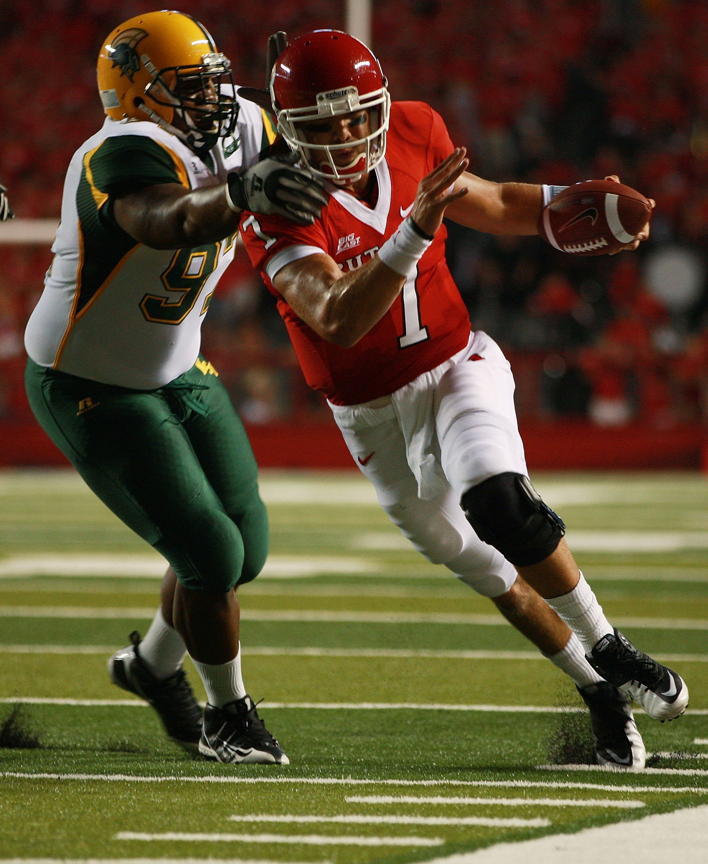 NEW BRUNSWICK, NJ - SEPTEMBER 02:  Jamal Giddens #9 of the Norfolk State Spartans attempts to tackle Tom Savage #7 of the Rutgers Scarlet Knights at Rutgers Stadium on September 2, 2010 in New Brunswick, New Jersey.  The Scarlet Knights beat the Spartans 