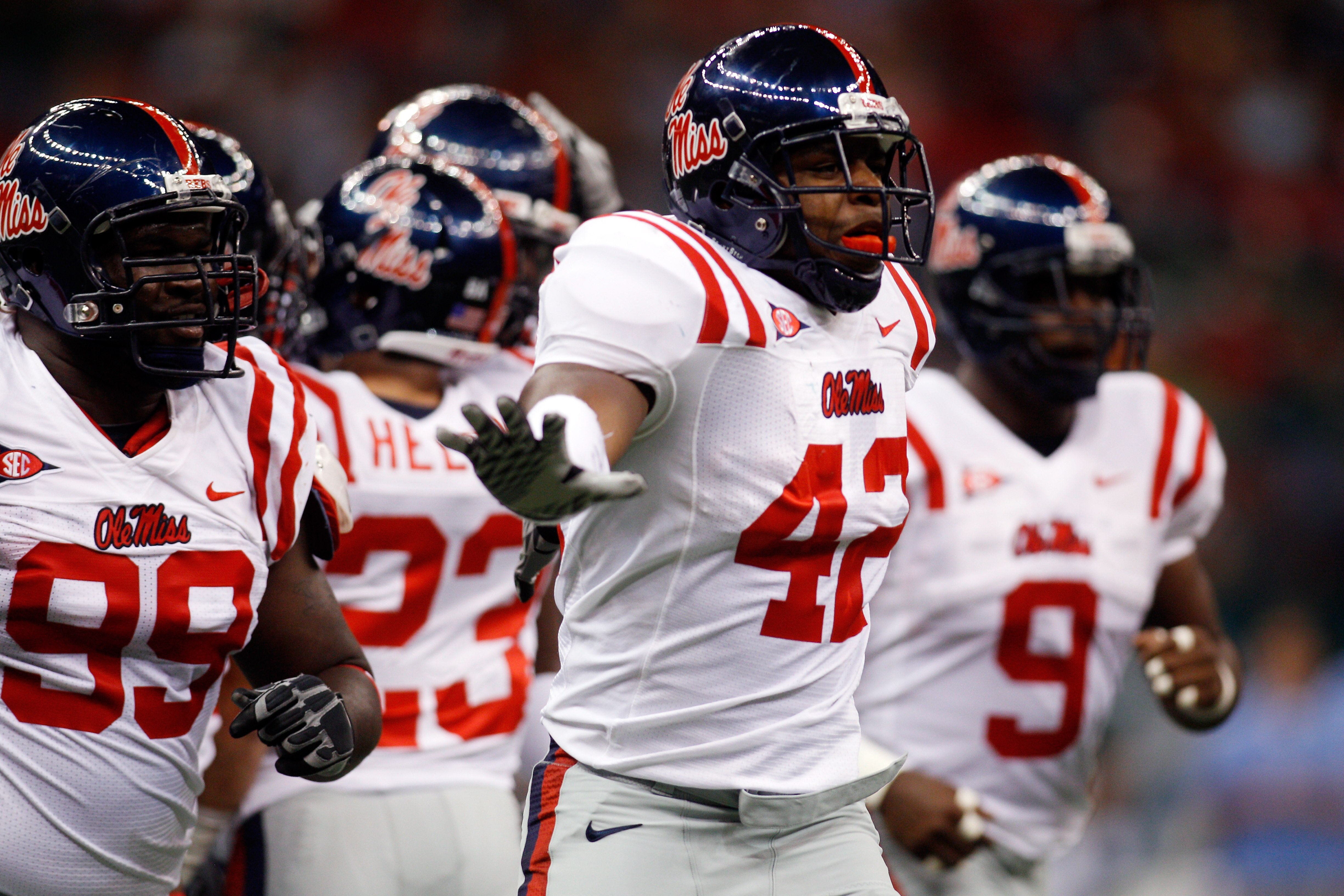 NEW ORLEANS - SEPTEMBER 11:  D.T. Shackelford #43 of the Ole Miss Rebels celebrates on the field after a sack against the Tulane Green Wave at the Louisiana Superdome on September 11, 2010 in New Orleans, Louisiana.  (Photo by Chris Graythen/Getty Images)