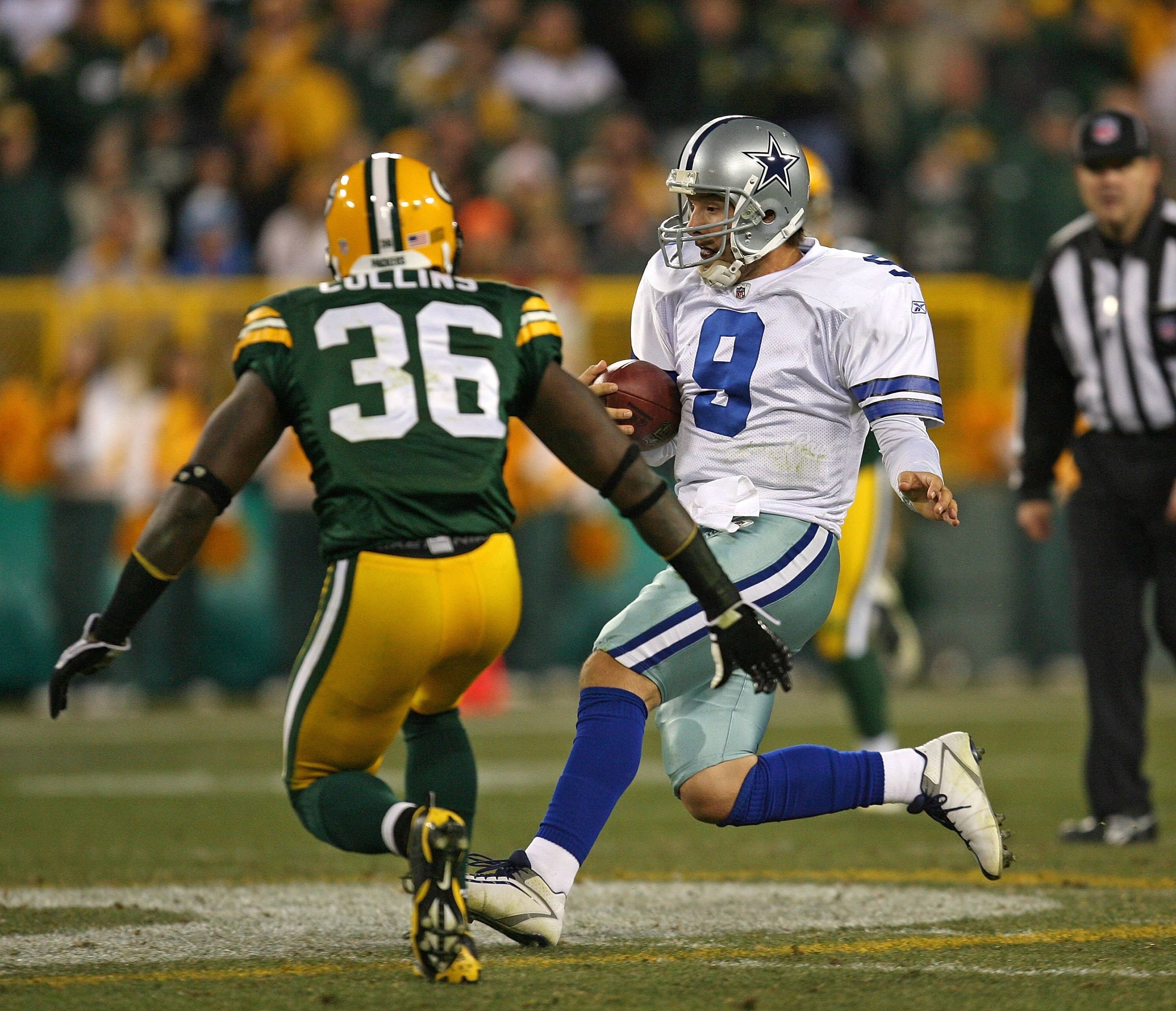 GREEN BAY, WI - NOVEMBER 15: Tony Romo #8 of the Dallas Cowboys runs for a first down as Nick Collins #36 of the Green Bay Packers closes in at Lambeau Field on November 15, 2009 in Green Bay, Wisconsin. The Packers defeated the Cowboys 17-7. (Photo by Jo