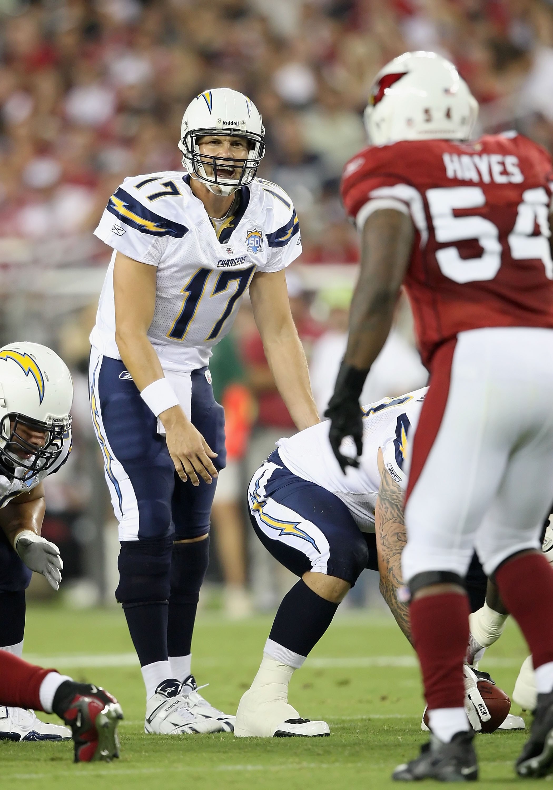 GLENDALE, AZ - AUGUST 22:  Quarterback Philip Rivers #17 of the San Diego Chargers prepares to snap the ball during the NFL game against the Arizona Cardinals at the University of Phoenix Stadium on August 22, 2009 in Glendale, Arizona. The Chargers defea