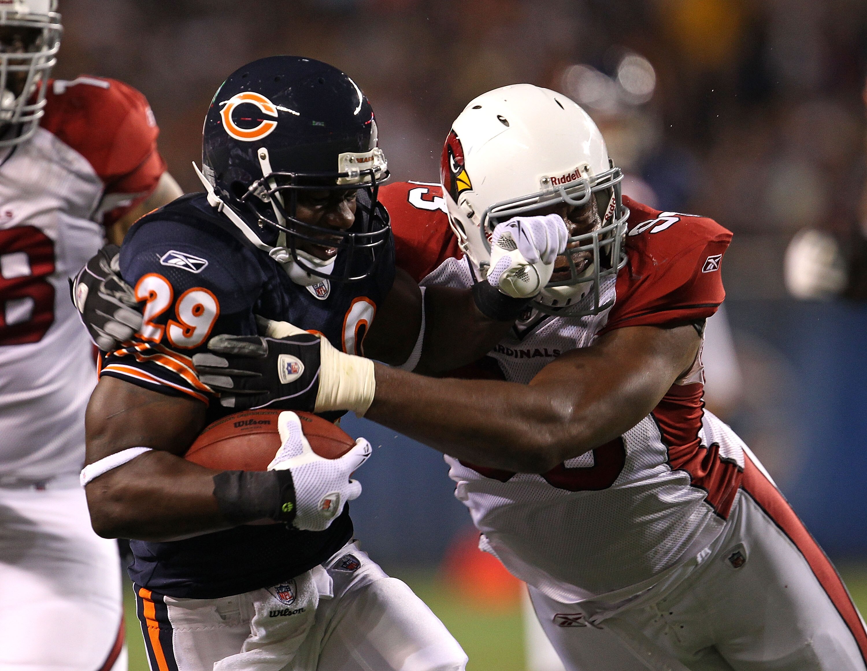 CHICAGO - AUGUST 28: Chester Taylor #29 of the Chicago Bears is hit by Calais Campbell #93 of the Arizona Cardinals during a preseason game at Soldier Field on August 28, 2010 in Chicago, Illinois. The Cardinals defeated the Bears 14-9. (Photo by Jonathan