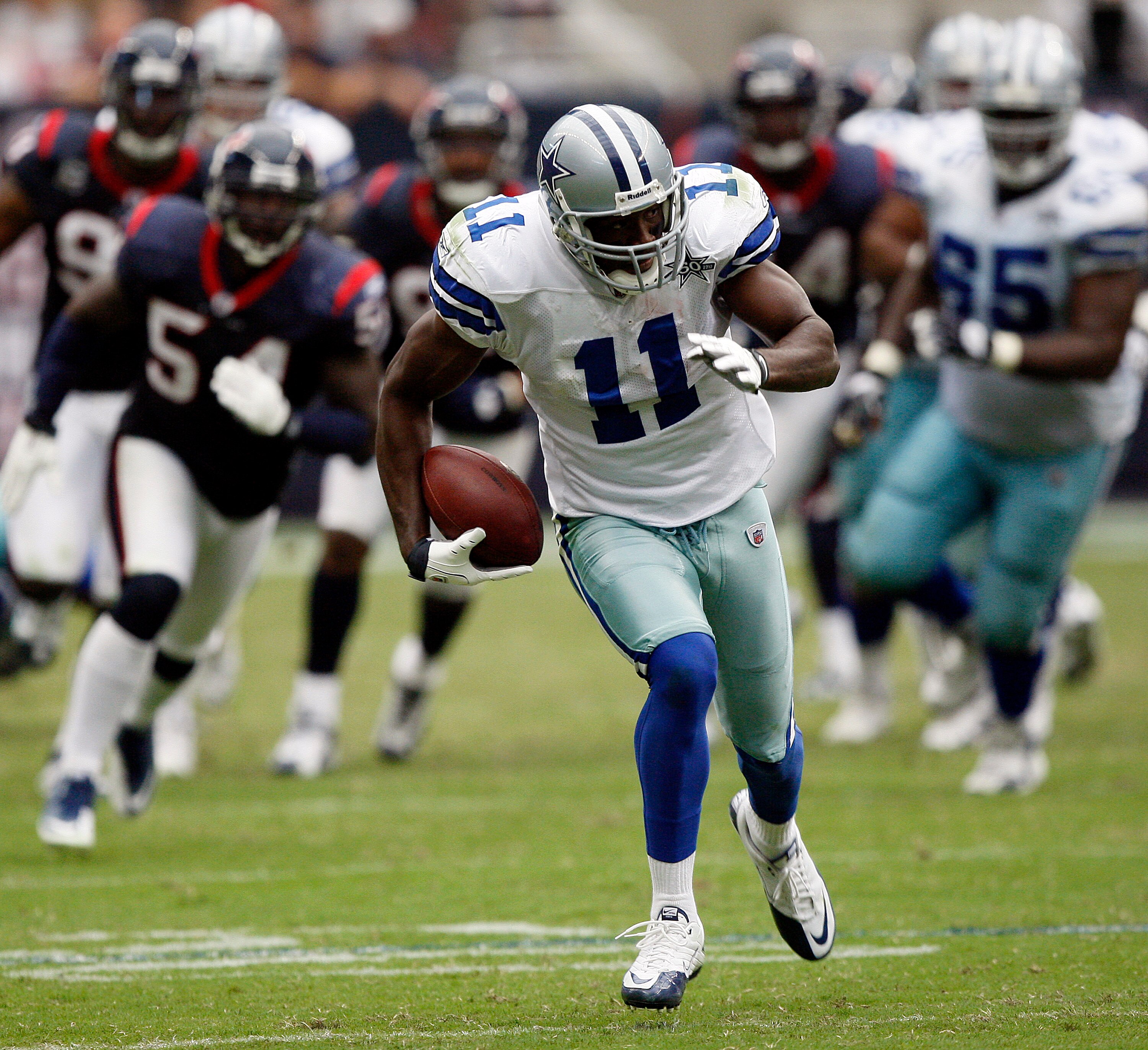 HOUSTON - SEPTEMBER 26:  Wide receiver Roy Williams #11 of the Dallas Cowboys runs for a 63 yard touchdown in the fourth quarter against the Houston Texans at Reliant Stadium on September 26, 2010 in Houston, Texas.  (Photo by Bob Levey/Getty Images)