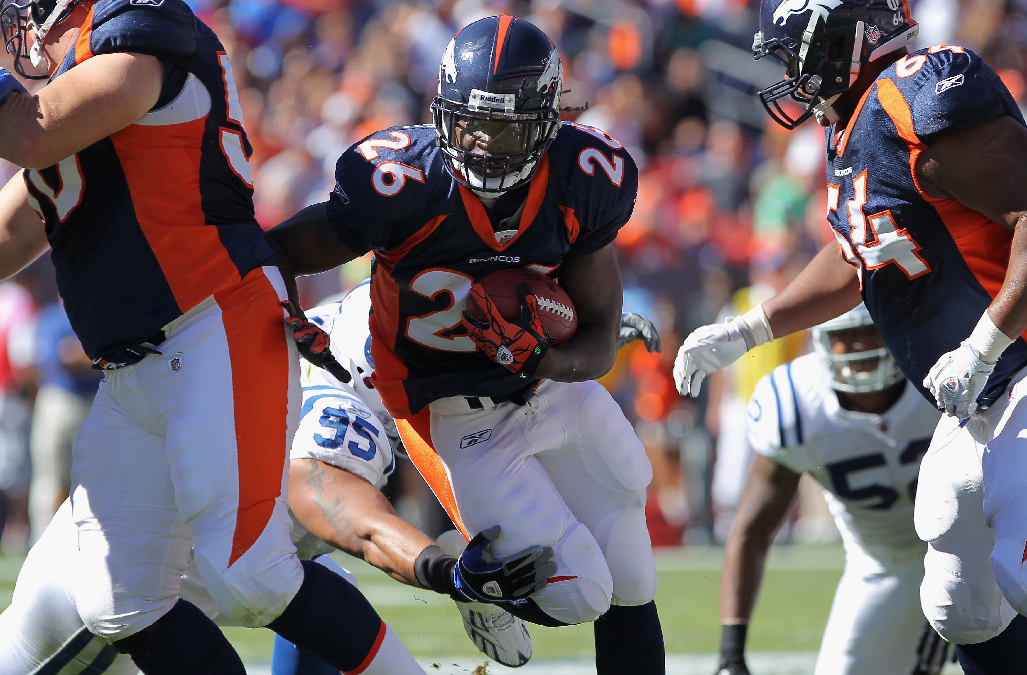 DENVER - SEPTEMBER 26:  Running back Laurence Maroney #26 of the Denver Broncos rushes with the ball against the Indianapolis Colts at INVESCO Field at Mile High on September 26, 2010 in Denver, Colorado. The Colts defeated the Broncos 27-13.  (Photo by D