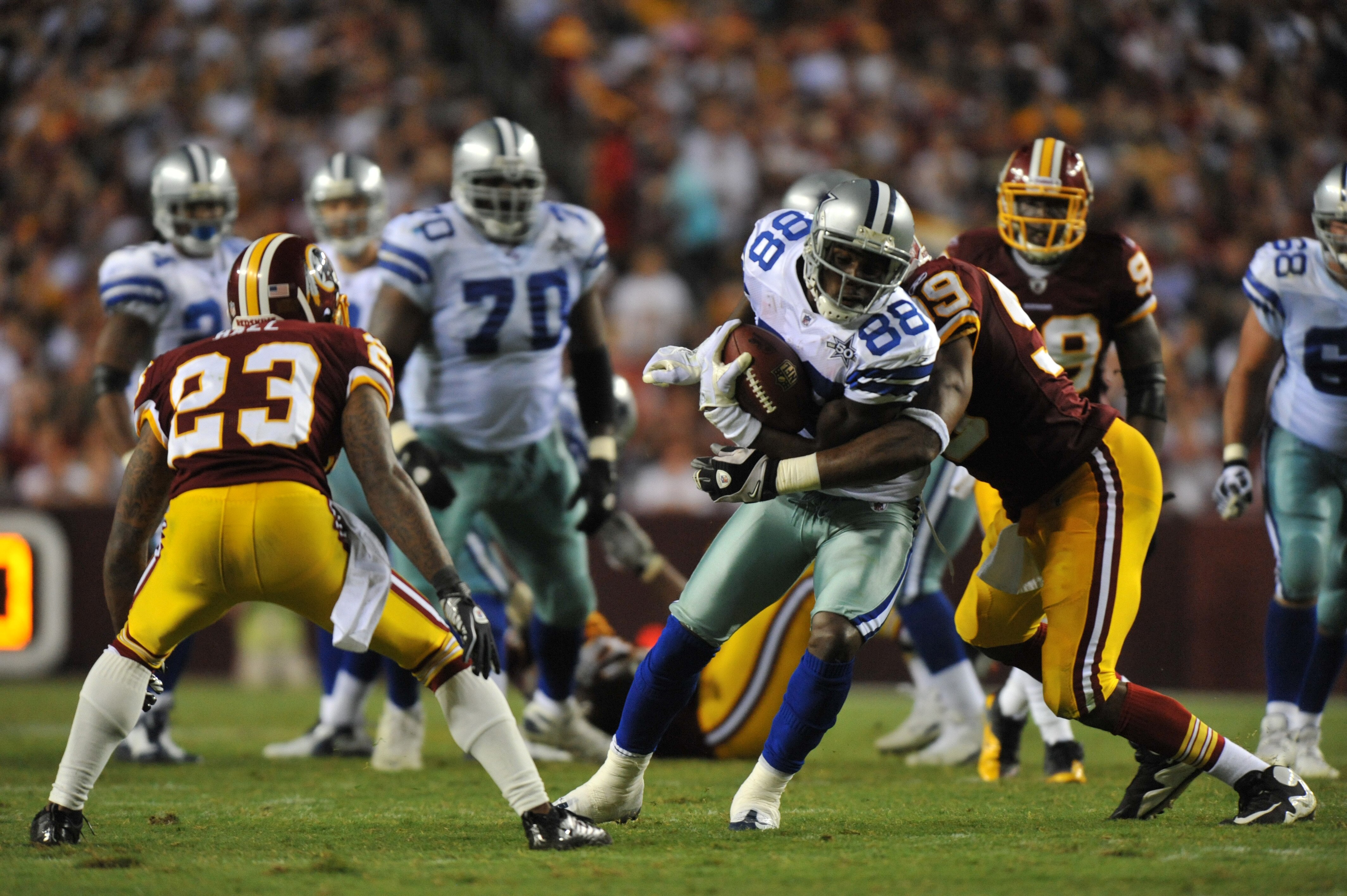 LANDOVER - SEPTEMBER 12:  Dez Bryant #88 of the Dallas Cowboys runs the ball after a catch during the NFL season opener against the Washington Redskins at FedExField on September 12, 2010 in Landover, Maryland. The Redskins defeated the Cowboys 13-7. (Pho
