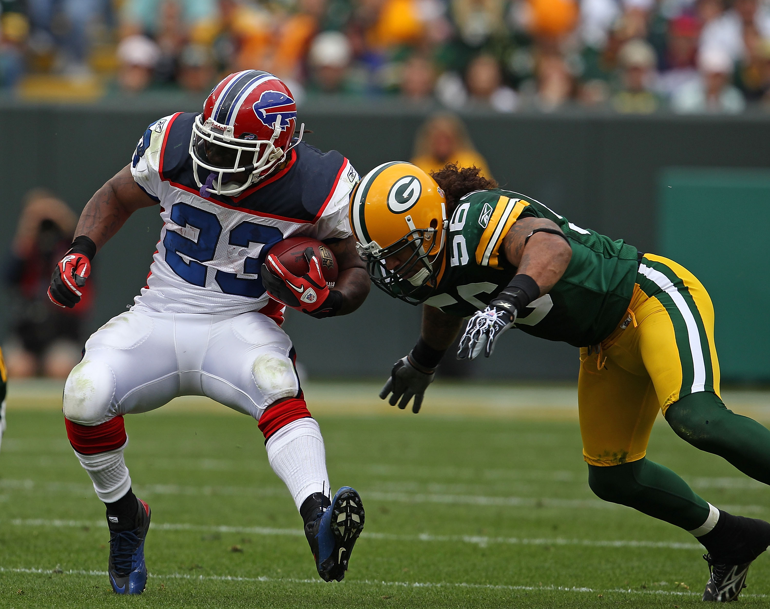 GREEN BAY, WI - SEPTEMBER 19: Nick Barnett #56 of the Green Bay Packers tackles Marshawn Lynch #23 of the Buffalo Bills at Lambeau Field on September 19, 2010 in Green Bay, Wisconsin. The Packers defeated the Bills 34-7. (Photo by Jonathan Daniel/Getty Im GREEN BAY, WI - SEPTEMBER 19: Nick Barnett #56 of the Green Bay Packers tackles Marshawn Lynch #23 of the Buffalo Bills at Lambeau Field on September 19, 2010 in Green Bay, Wisconsin. The Packers defeated the Bills 34-7. (Photo by Jonathan Daniel/Getty Im