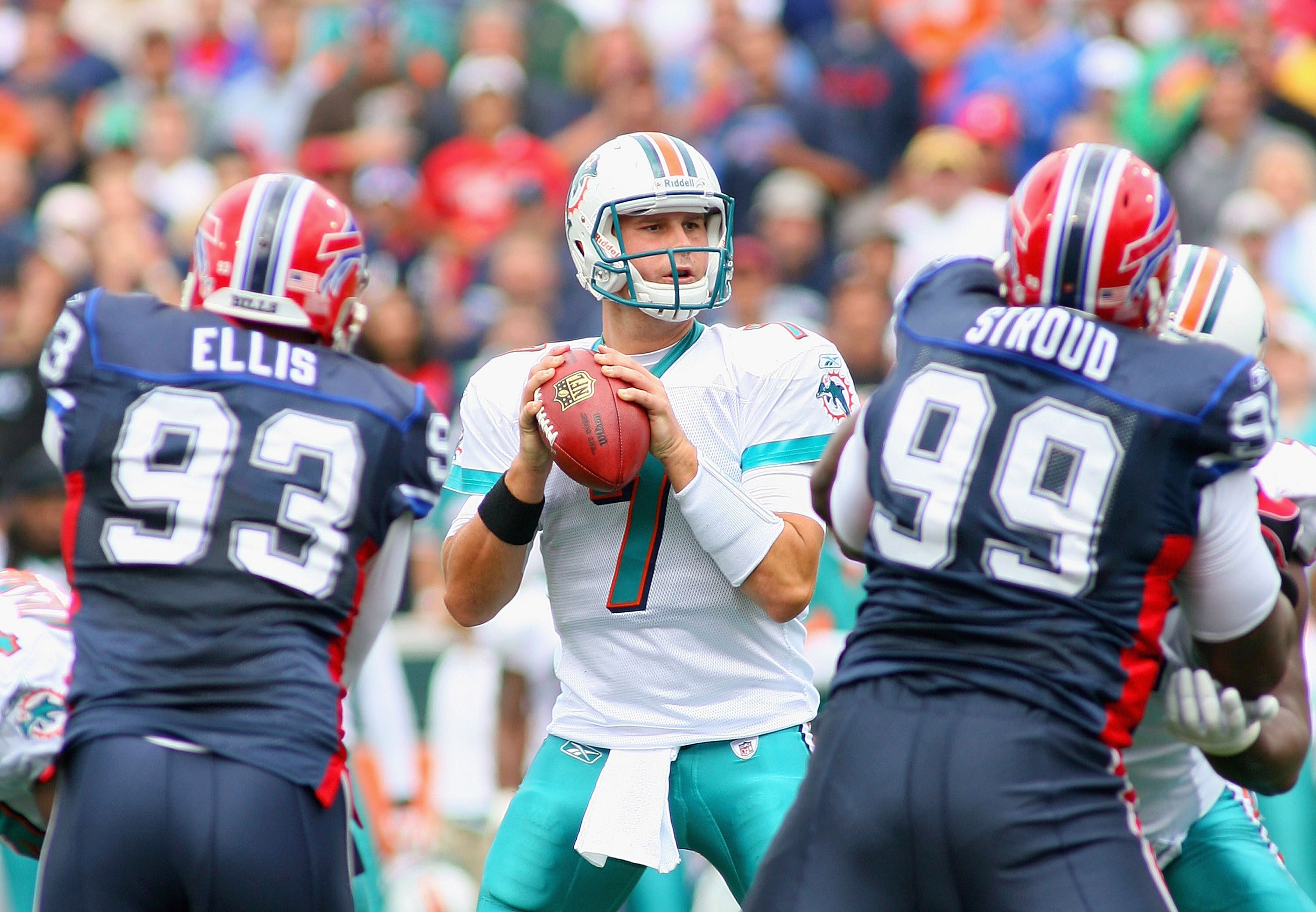 ORCHARD PARK, NY - SEPTEMBER 12: Chad Henne #7 of the Miami Dolphins readies to pass as Chris Ellis #93 and Marcus Stroud #99 of the Buffalo Bills rush during the NFL season opener at Ralph Wilson Stadium on September 12, 2010 in Orchard Park, New York. ORCHARD PARK, NY - SEPTEMBER 12: Chad Henne #7 of the Miami Dolphins readies to pass as Chris Ellis #93 and Marcus Stroud #99 of the Buffalo Bills rush during the NFL season opener at Ralph Wilson Stadium on September 12, 2010 in Orchard Park, New York.