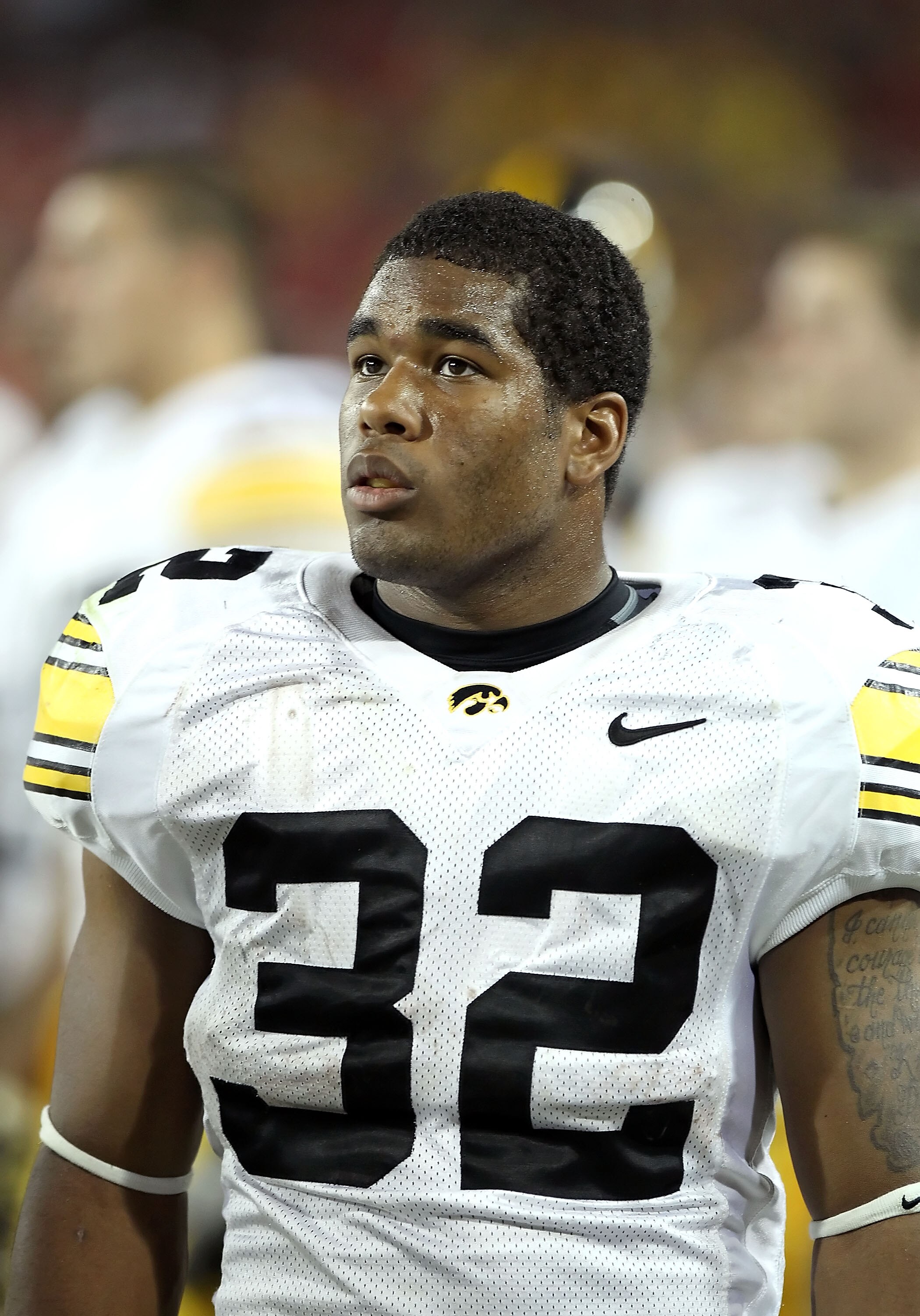 TUCSON, AZ - SEPTEMBER 18:  Runningback Adam Robinson #32 of the Iowa Hawkeyes watches from the sidelines during the college football game against the Arizona Wildcats at Arizona Stadium on September 18, 2010 in Tucson, Arizona. The Wildcats defeated the