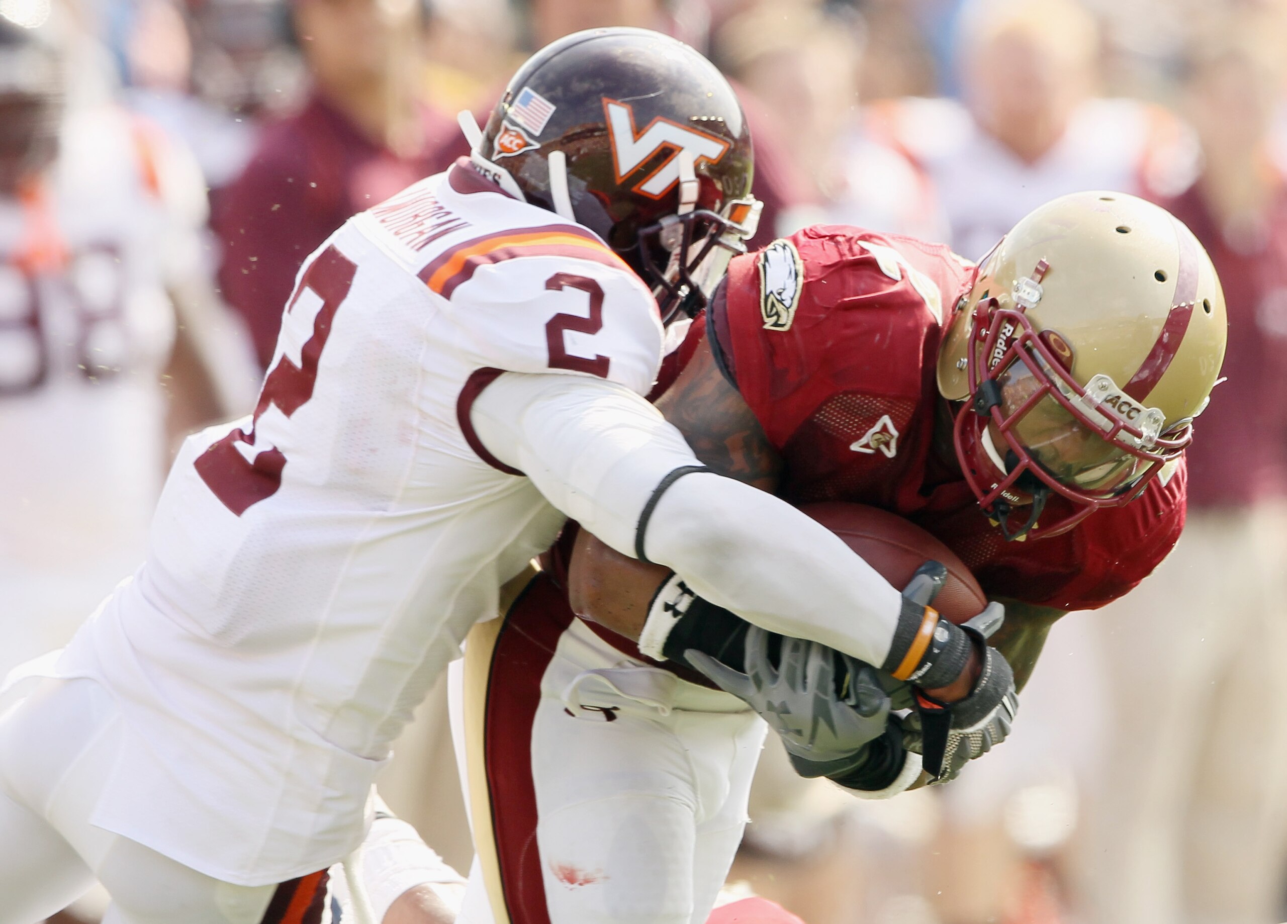CHESTNUT HILL, MA - SEPTEMBER 25:  Montel Harris #2 of the Boston College Eagles is taken down by Davon Morgan #2 of the Virginia Tech Hokies on September 25, 2010 at Alumni Stadium in Chestnut Hill, Massachusetts.  (Photo by Elsa/Getty Images)