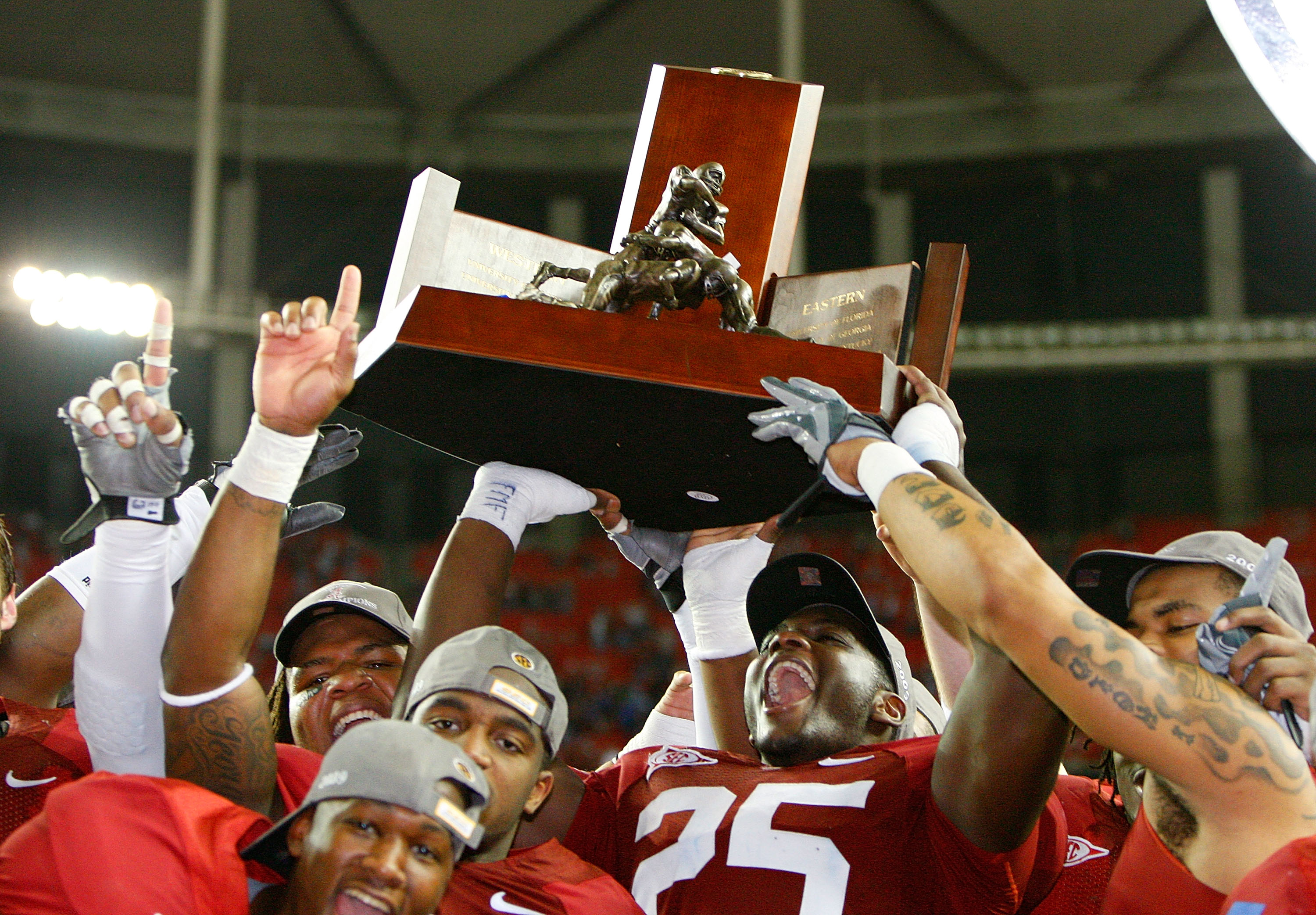 ATLANTA - DECEMBER 05:  Rolando McClain #25 of the Alabama Crimson Tide celebrates with the trophy after their 32-13 win over the Florida Gators in the SEC Championship at Georgia Dome on December 5, 2009 in Atlanta, Georgia.  (Photo by Kevin C. Cox/Getty