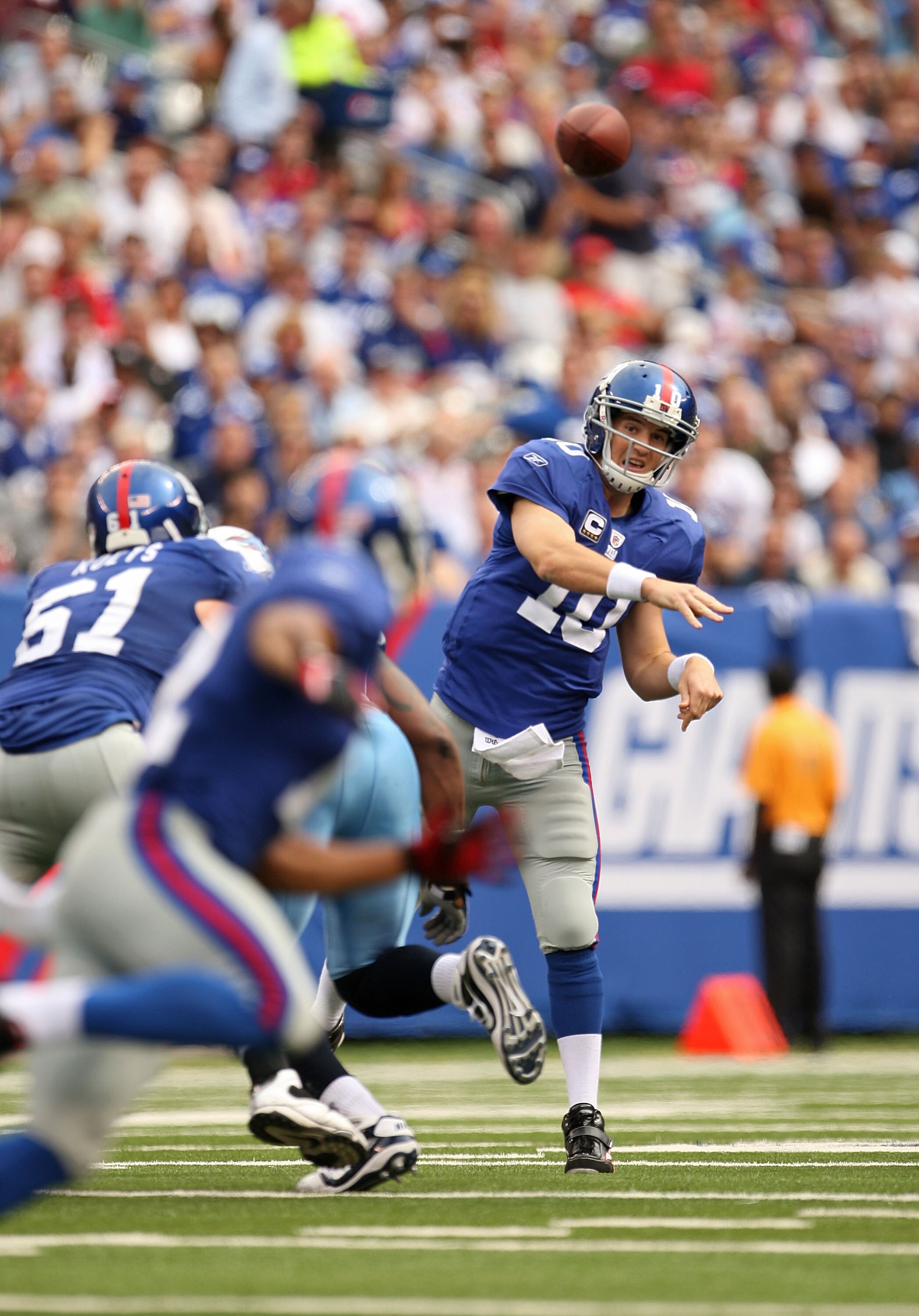 EAST RUTHERFORD, NJ - SEPTEMBER 26:  Eli Manning #10 of the New York Giants Passes during a game against the Tennessee Titans at New Meadowlands Stadium on September 26, 2010 in East Rutherford, New Jersey.  (Photo by Mike Ehrmann/Getty Images)