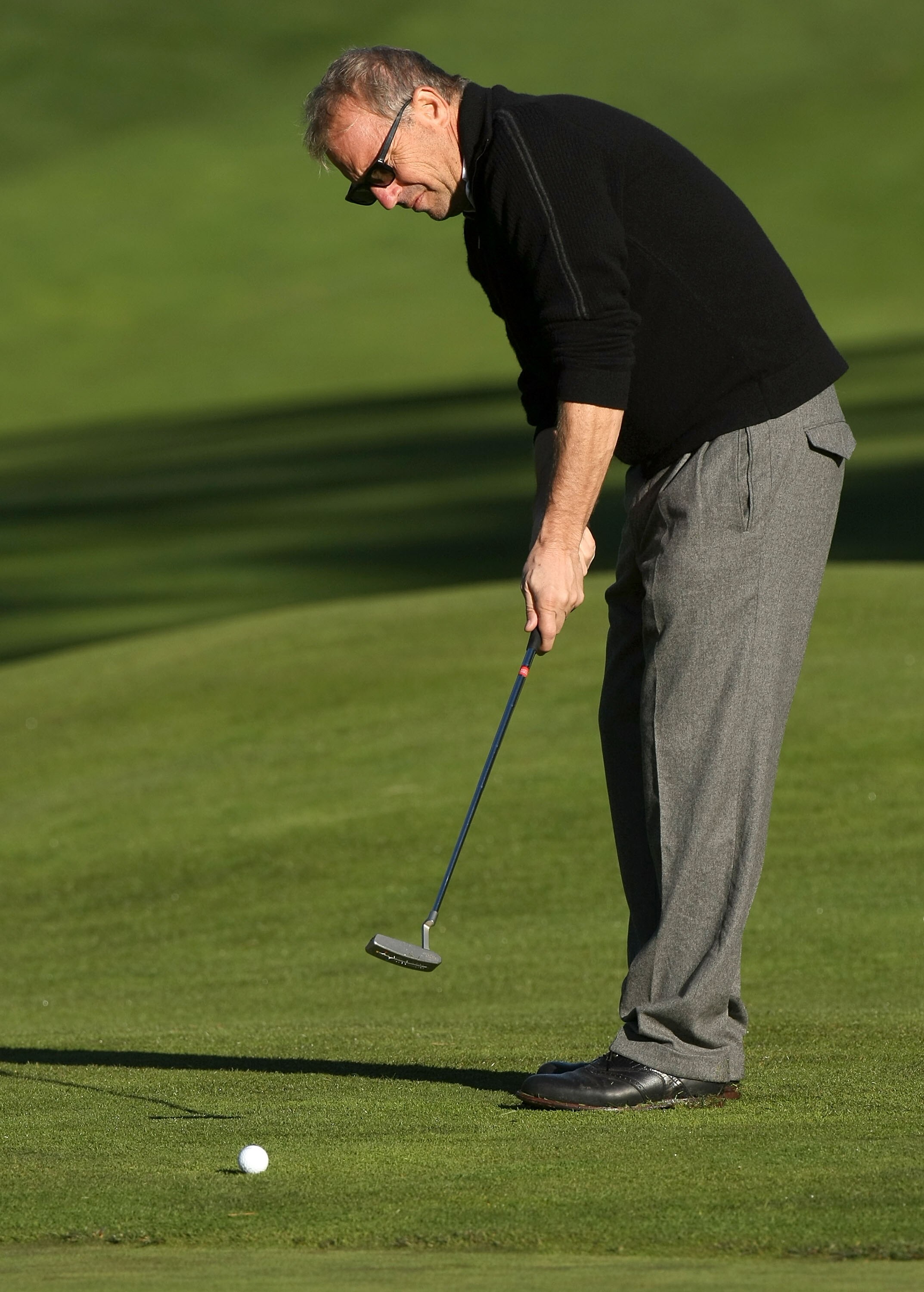 PEBBLE BEACH, CA - FEBRUARY 07:  Actor Kevin Costner putts on the third hole during the first round of the AT&T Pebble Beach National Pro-Am at Poppy Hills Golf Course February 7, 2008  in Pebble Beach, California.  (Photo by Stephen Dunn/Getty Images)