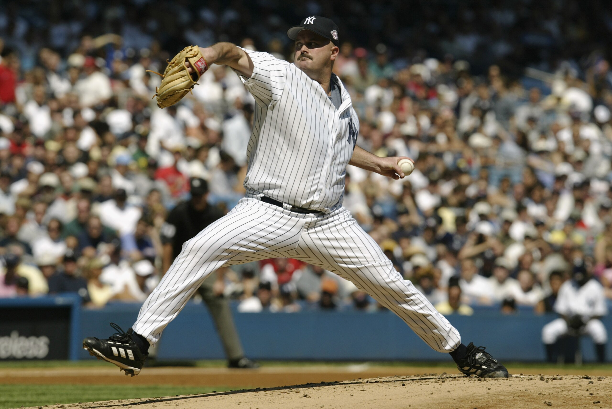 BRONX, NY - SEPTEMBER 7:  David Wells #33 of the New York Yankees pitches against the Boston Red Sox at Yankee Stadium on September 7, 2003 in the Bronx, New York. The Yankees defeated the Red Sox 3-1. (Photo by Chris Trotman/Getty Images)