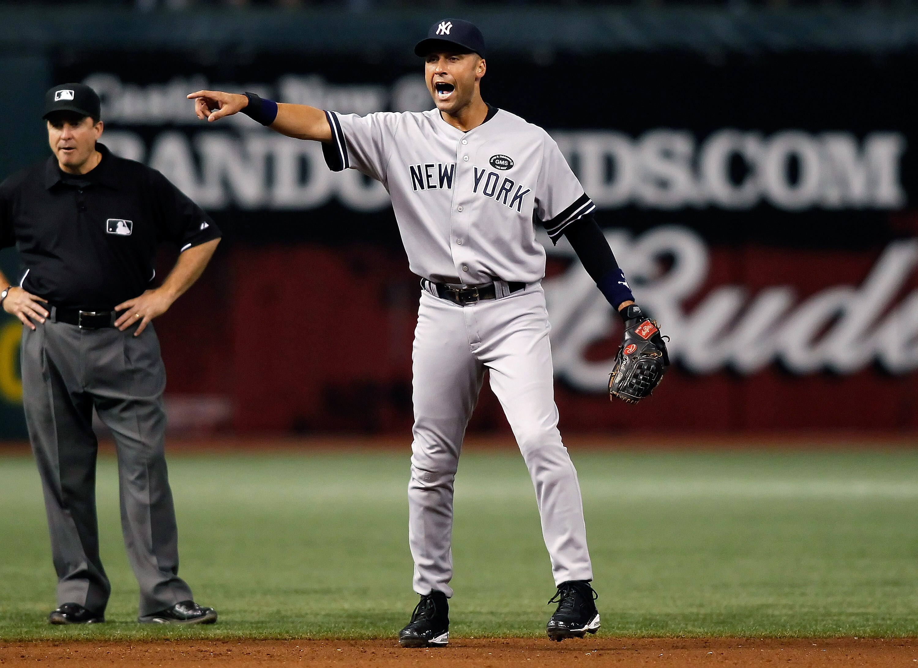 ST. PETERSBURG, FL - SEPTEMBER 14:  Infielder Derek Jeter #2 of the New York Yankees shouts for help from the umpire against the Tampa Bay Rays during the game at Tropicana Field on September 14, 2010 in St. Petersburg, Florida.  (Photo by J. Meric/Getty
