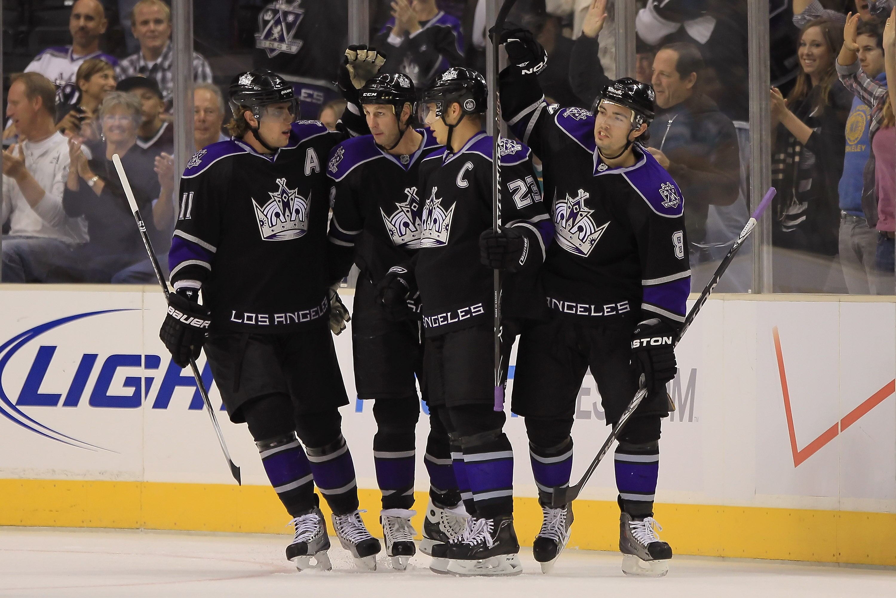 LOS ANGELES, CA - SEPTEMBER 28:  (L-R) Anze Kopitar #11, Ryan Smyth #94, Dustin Brown #23 and Drew Doughty #8 of the Los Angeles Kings celebrate Smyth's first period goal against the Anaheim Ducks at Staples Center on September 28, 2010 in Los Angeles, Ca