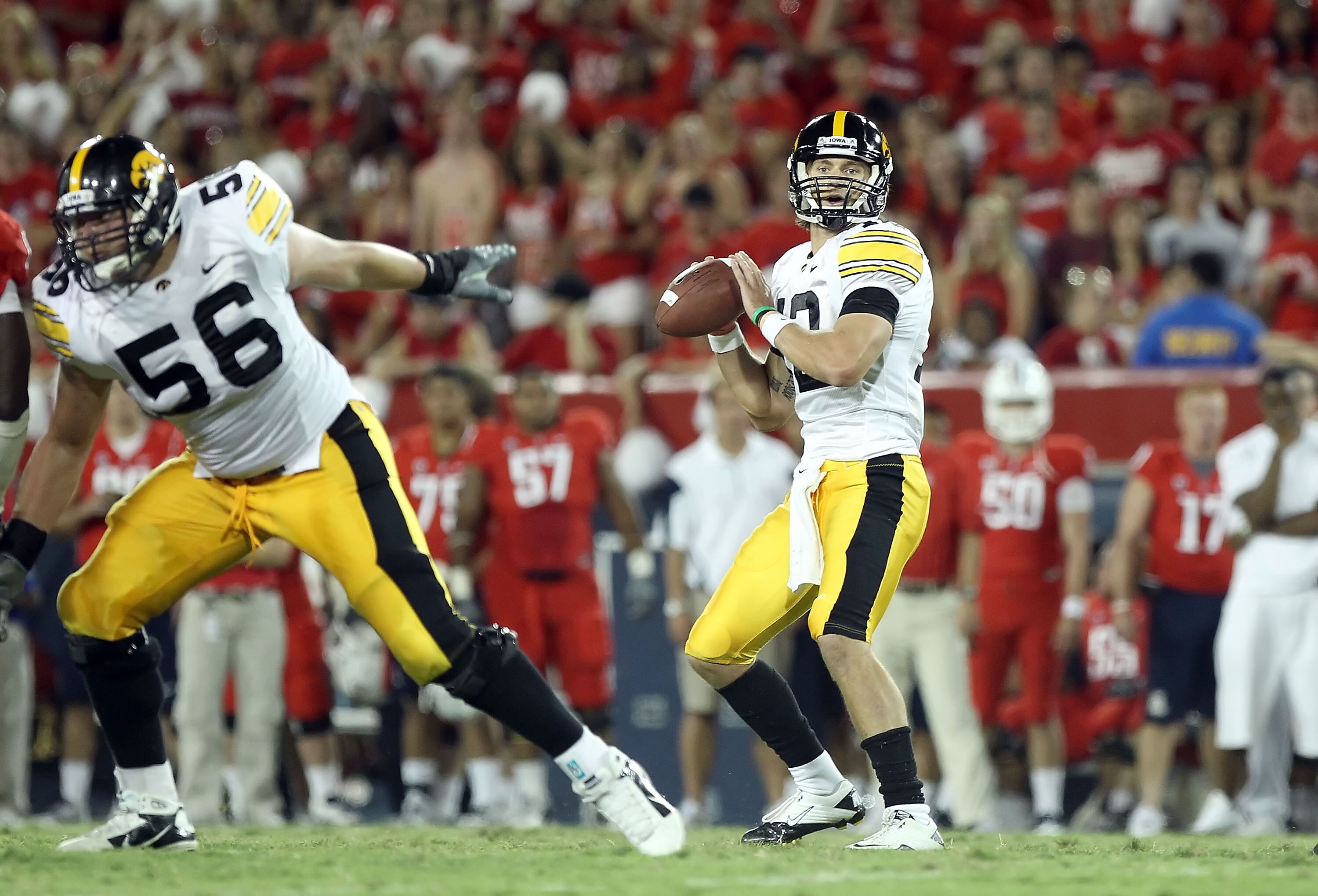 TUCSON, AZ - SEPTEMBER 18:  Quarterback Ricky Stanzi #12 of the Iowa Hawkeyes drops back to pass during the college football game against the Arizona Wildcats at Arizona Stadium on September 18, 2010 in Tucson, Arizona.  The Wildcats defeated the Hawkeyes