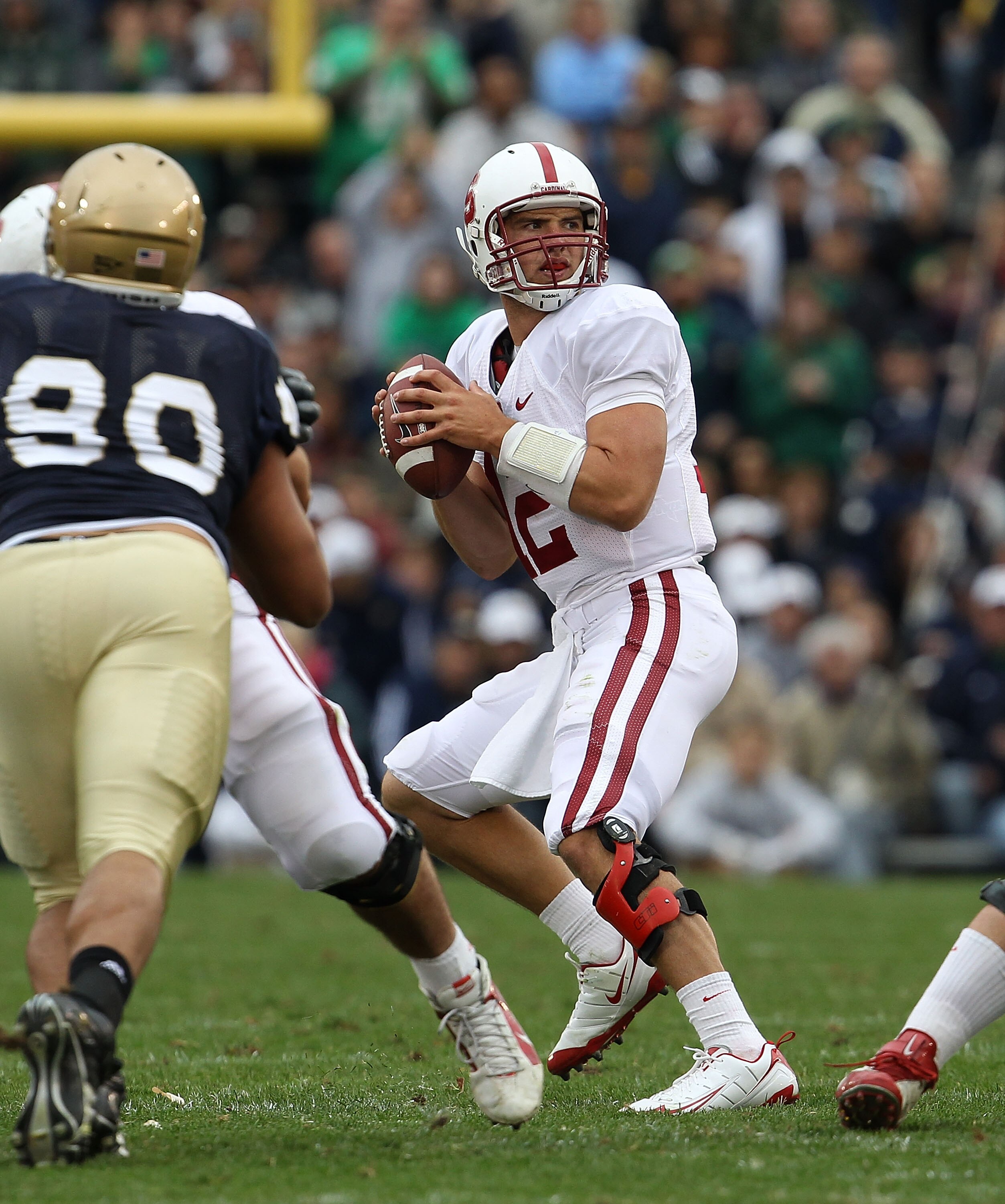 SOUTH BEND, IN - SEPTEMBER 25: Andrew Luck #12 of the Stanford Cardinal looks for a receiver against the Notre Dame Fighting Irish at Notre Dame Stadium on September 25, 2010 in South Bend, Indiana. Stanford defeated Notre Dame 37-14. (Photo by Jonathan D