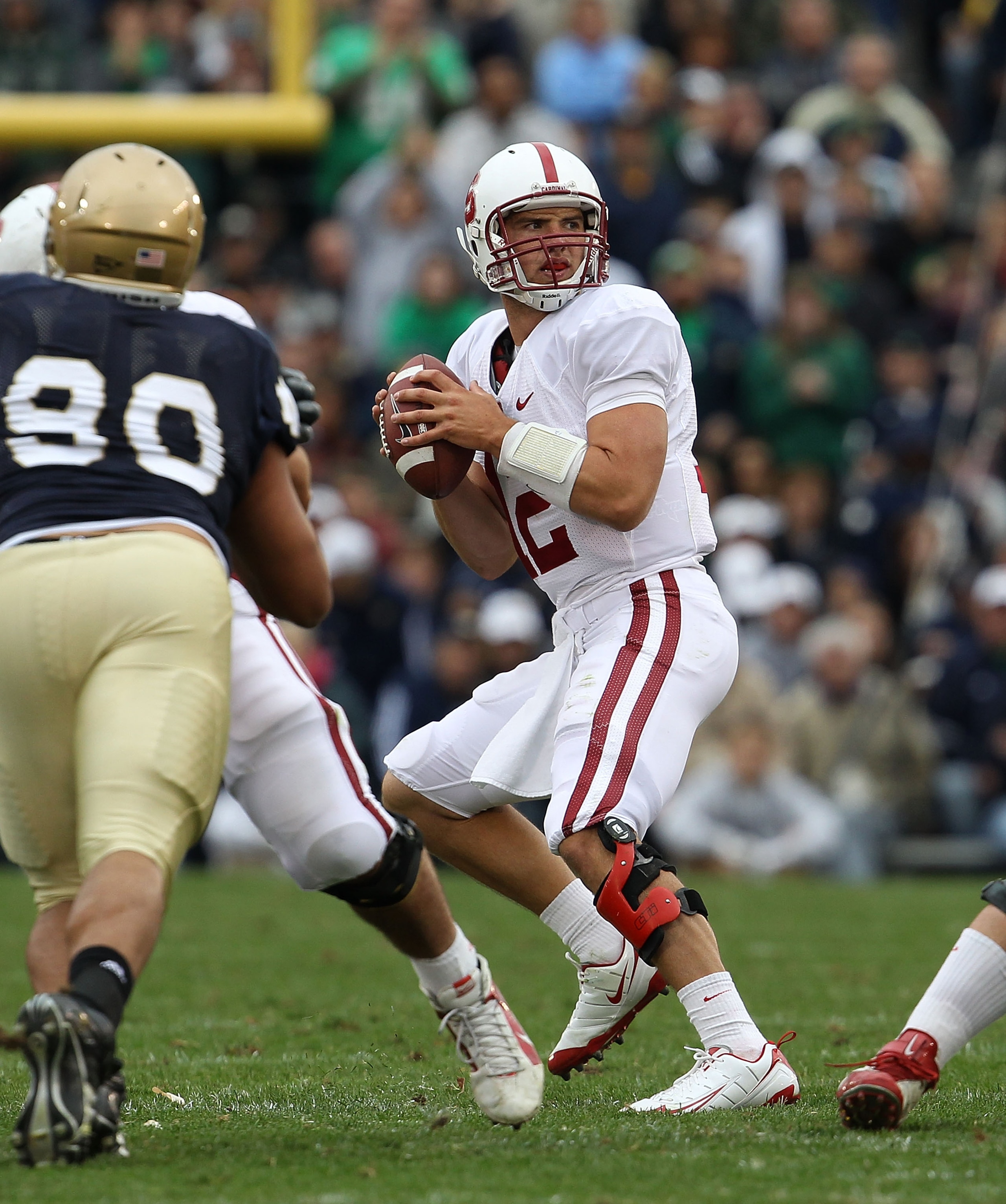 SOUTH BEND, IN - SEPTEMBER 25: Andrew Luck #12 of the Stanford Cardinal looks for a receiver against the Notre Dame Fighting Irish at Notre Dame Stadium on September 25, 2010 in South Bend, Indiana. Stanford defeated Notre Dame 37-14. (Photo by Jonathan D