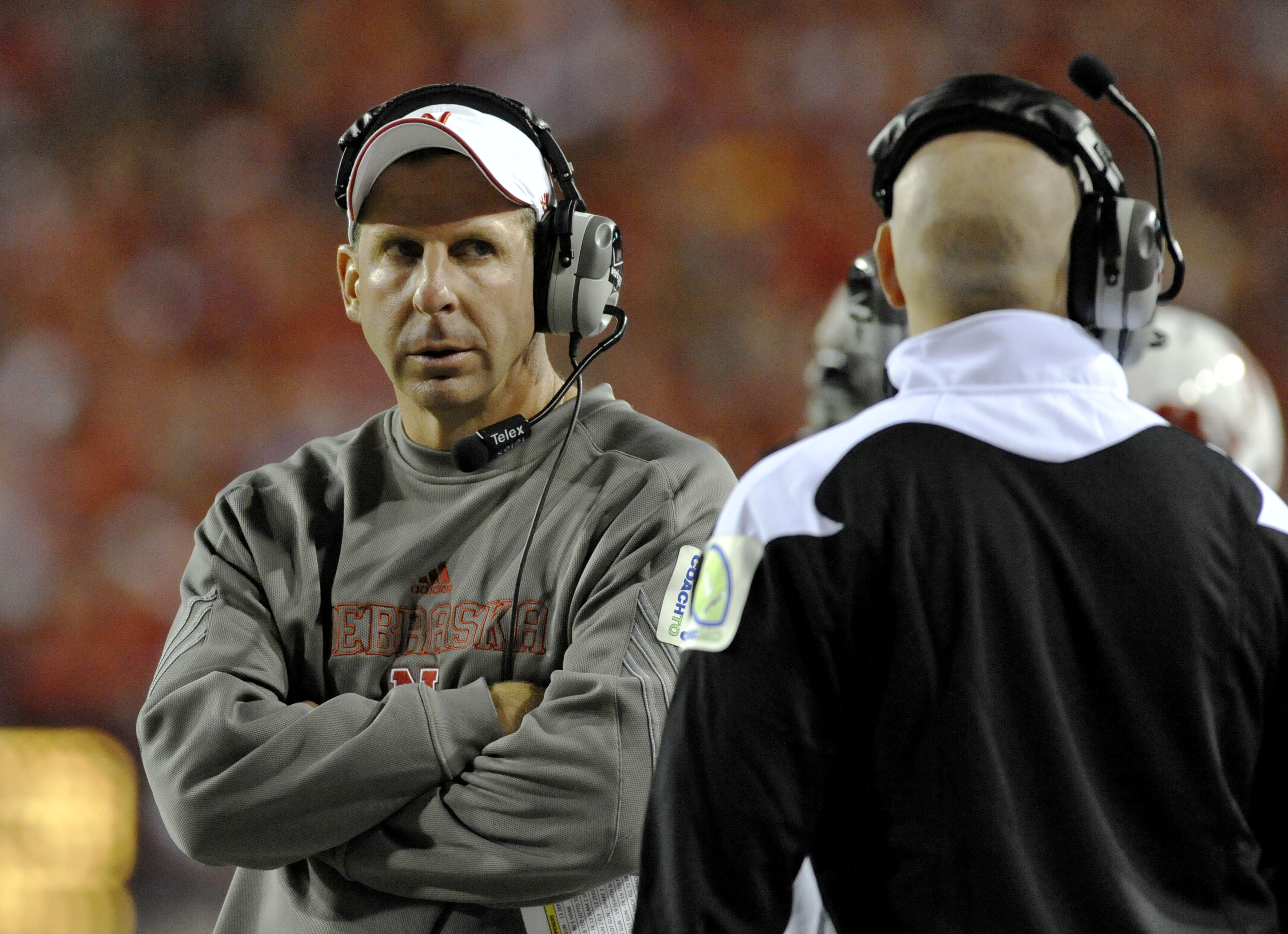 LINCOLN, NE - SEPTEMBER 25: Coach Bo Pelini of the Nebraska Cornuskers eyes his defensive coaching slaff during second half action of their game against the South Dakota State Jackrabbits at Memorial Stadium on September 25, 2010 in Lincoln, Nebraska. Neb