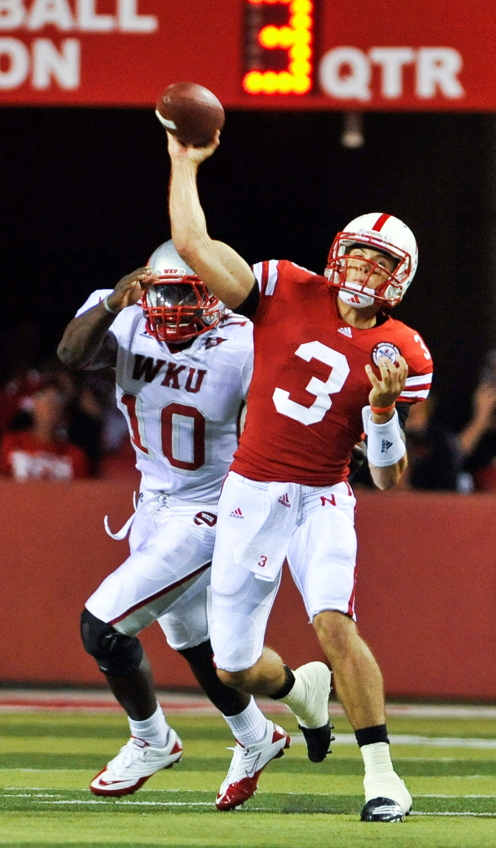 LINCOLN, NE - SEPTEMBER 04: Taylor Martinez #3 of the Nebraska Cornhuskers  passes the ball down field against the Western Kentucky Hilltoppers  during first half action of their game at Memorial Stadium on September 4, 2010 in Lincoln, Nebraska. Nebraska