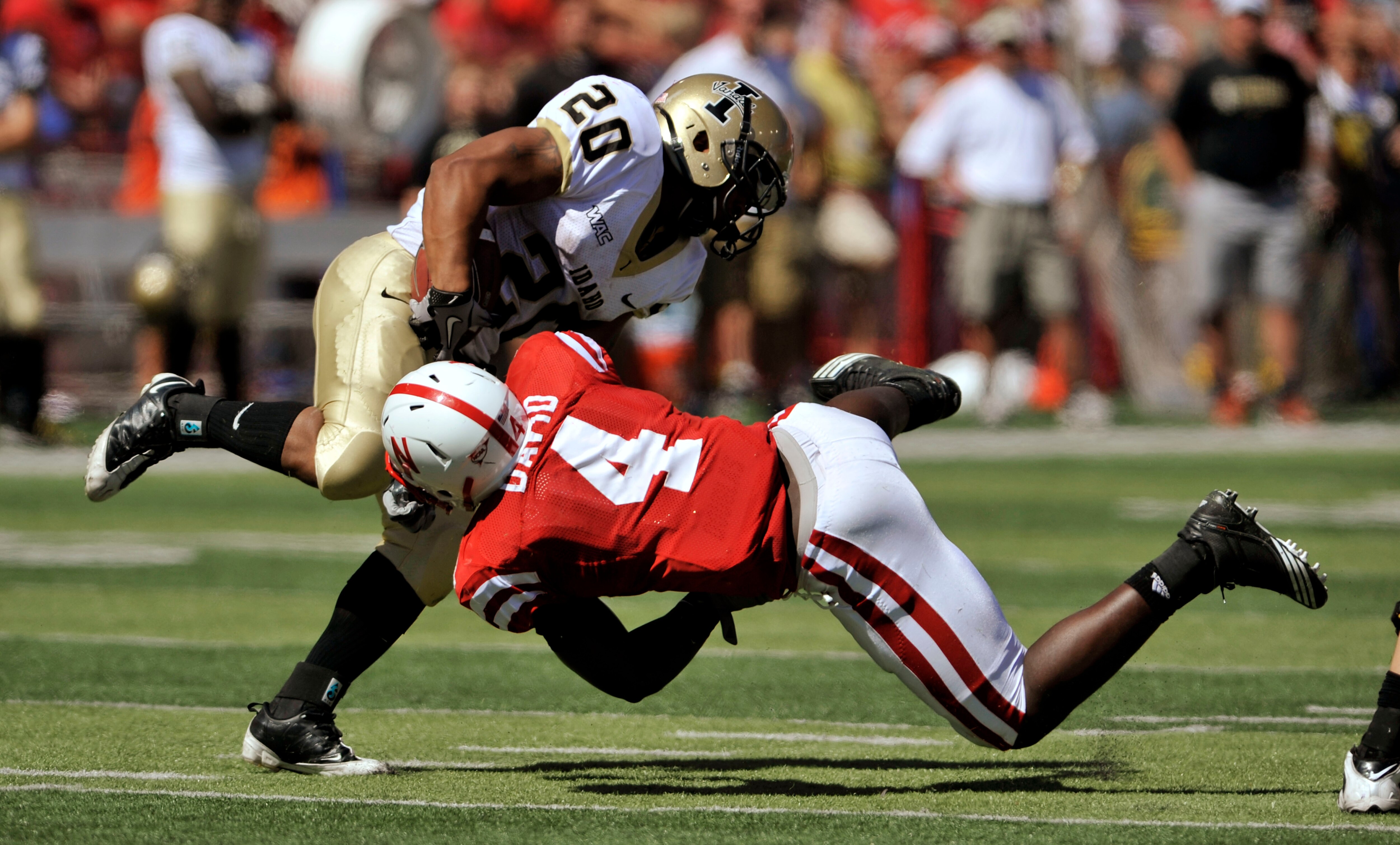LINCOLN, NEBRASKA - SEPTEMBER 11: Nebraska Cornhuskers linebacker Lavonte David tries to bring down Princeton McCarty #20 during second half action of their game at Memorial Stadium on September 4, 2010 in Lincoln, Nebraska. Nebraska defeated Idaho 38-17.