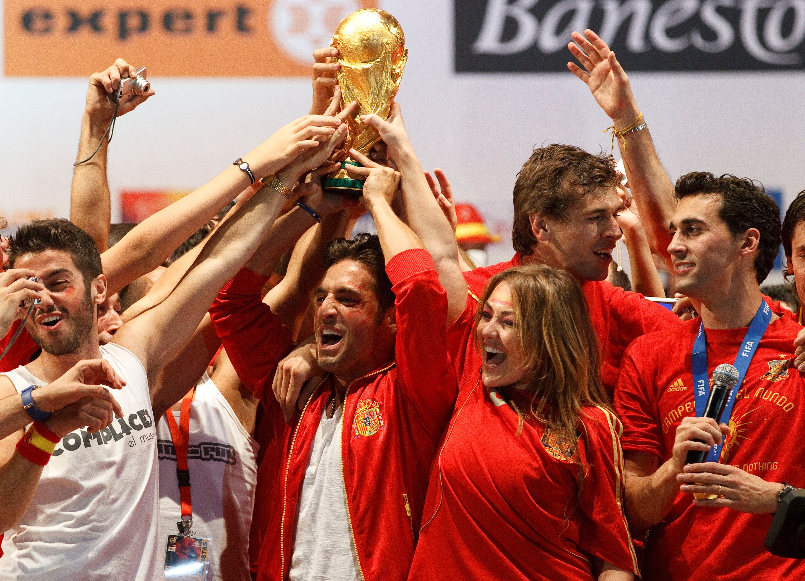 MADRID, SPAIN - JULY 12: MADRID, SPAIN - JULY 12: Spanish musicians David Bisbal and amaia Montero hold on the trophy on a stage set up for the Spanish team victory ceremony on July 12, 2010 in Madrid, Spain. Spain won the 2010 FIFA football World Cup mat