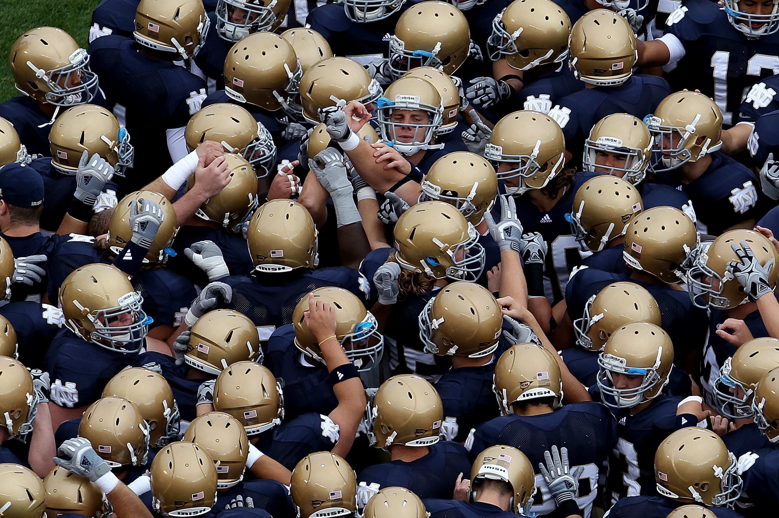 SOUTH BEND, IN - SEPTEMBER 25: Members of the Notre Dame Fighting Irish get ready during warm-ups to play the Stanford Cardinal at Notre Dame Stadium on September 25, 2010 in South Bend, Indiana. Stanford defeated Notre Dame 37-14. (Photo by Jonathan Dani SOUTH BEND, IN - SEPTEMBER 25: Members of the Notre Dame Fighting Irish get ready during warm-ups to play the Stanford Cardinal at Notre Dame Stadium on September 25, 2010 in South Bend, Indiana. Stanford defeated Notre Dame 37-14. (Photo by Jonathan Dani