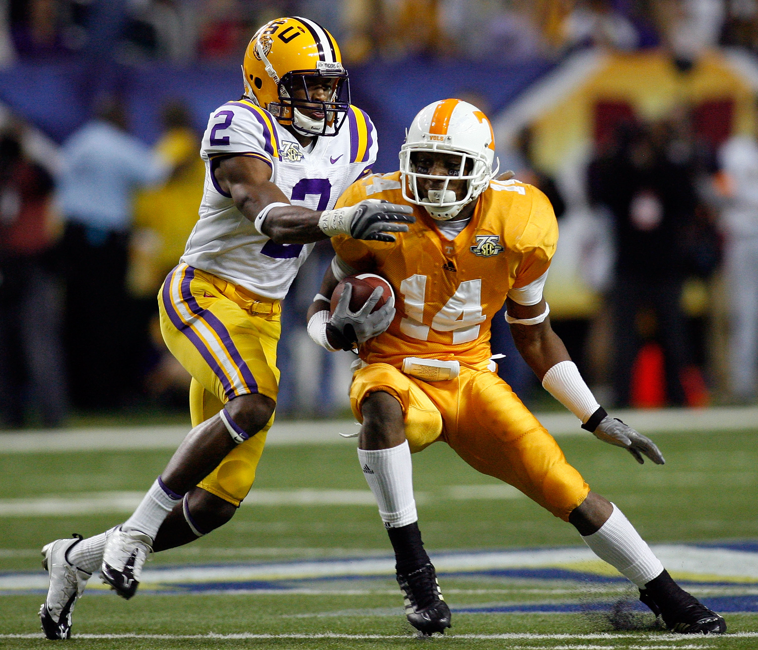 ATLANTA - DECEMBER 01:  Eric Berry #14 of the University of Tennessee Volunteers is tackled after an interception by Demetrius Byrd #2 of the Louisiana State University Tigers during the SEC Championship game on December 1, 2007 at the Georgia Dome in Atl