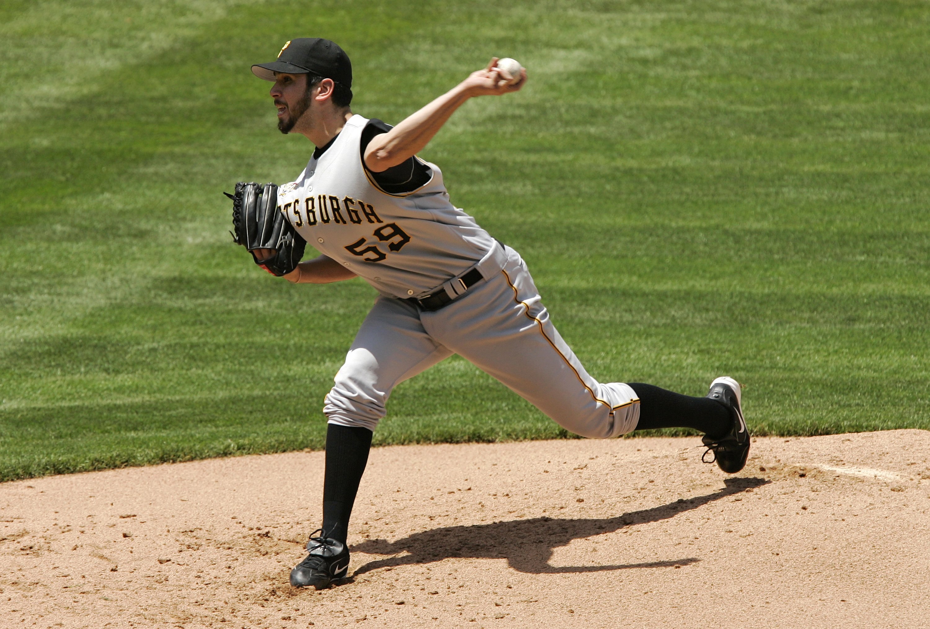 DENVER - JUNE 07:  Starting pitcher Oliver Perez #59 of the Pittsburgh Pirates throws against the Colorado Rockies in the first inning on June 7, 2006 at Coors Field in Denver, Colorado. The Rockies lead 11-2 after four innings.  (Photo by Brian Bahr/Gett