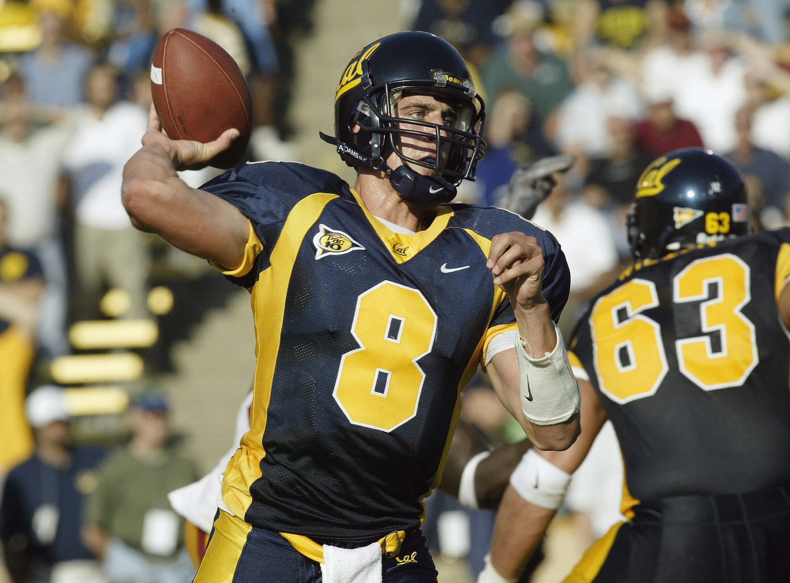 BERKELEY, CA - SEPTEMBER 27: Quarterback Aaron Rodgers #8 of the California Golden Bears makes the pass during the game against the USC Trojans at Memorial Stadium on September 27, 2003 in Berkeley, California. Cal won 34-31 in triple overtime. (Photo BERKELEY, CA - SEPTEMBER 27: Quarterback Aaron Rodgers #8 of the California Golden Bears makes the pass during the game against the USC Trojans at Memorial Stadium on September 27, 2003 in Berkeley, California. Cal won 34-31 in triple overtime. (Photo