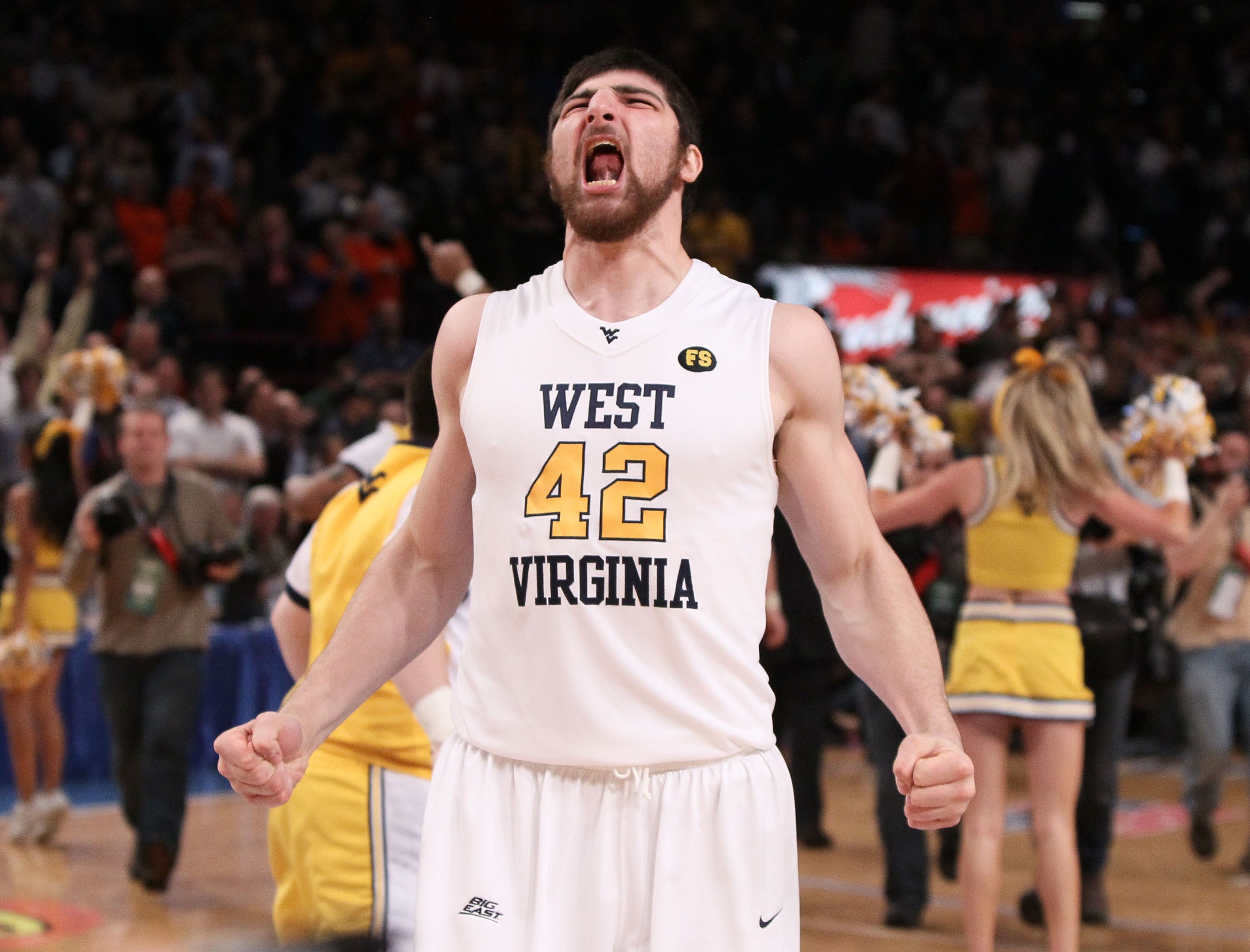 NEW YORK - MARCH 13:  Deniz Kilicli #42 of the West Virginia Mountaineers celebrates after defeating the Georgetown Hoyas during the championship of the 2010 NCAA Big East Tournament at Madison Square Garden on March 13, 2010 in New York City.  (Photo by