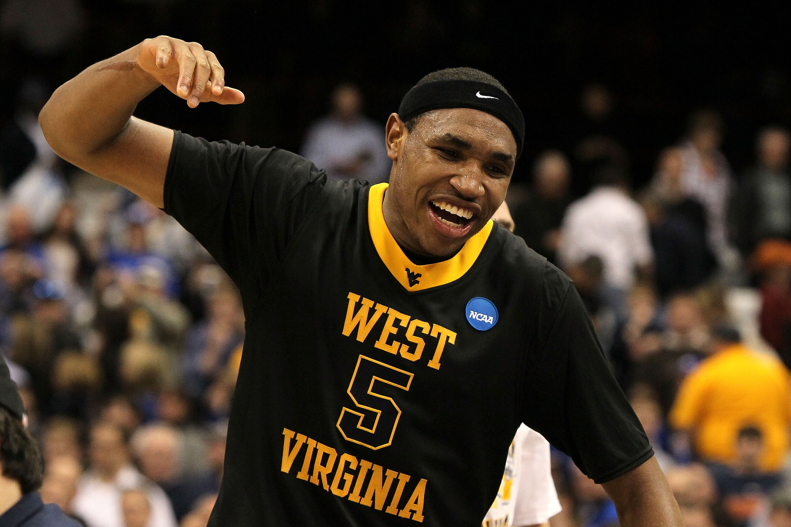 SYRACUSE, NY - MARCH 27:  Kevin Jones #5 of the West Virginia Mountaineers celebrates after West Virginia won 73-66 against the Kentucky Wildcats during the east regional final of the 2010 NCAA men's basketball tournament at the Carrier Dome on March 27,