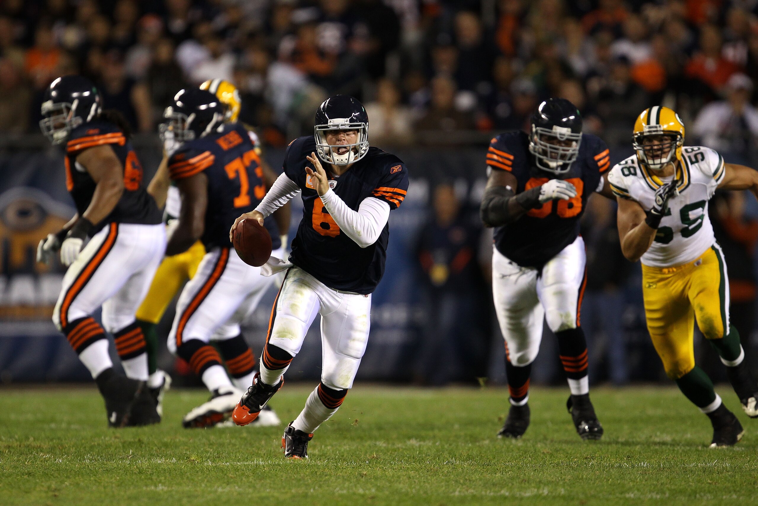 CHICAGO - SEPTEMBER 27:  Jay Cutler #6 of the Chicago Bears runs with the ball against the Green Bay Packers at Soldier Field on September 27, 2010 in Chicago, Illinois.  (Photo by Jonathan Daniel/Getty Images)