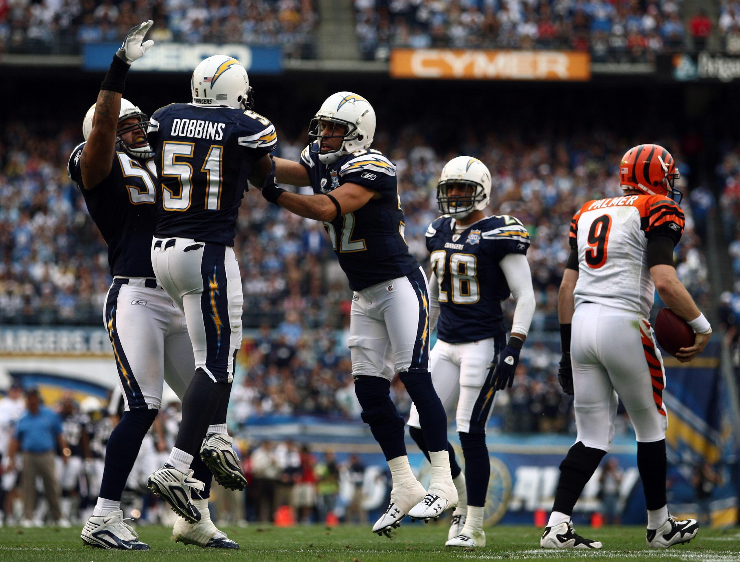 SAN DIEGO, CA - DECEMBER 20:  Shawne Merriman #56, Larry English #52 celebrate Tim Dobbins #51 of the San Diego Chargers stop of quarterback Carson Palmer #9 of the Cincinnati Bengals during the NFL game on December 20, 2009 at Qualcomm Stadium in San Die