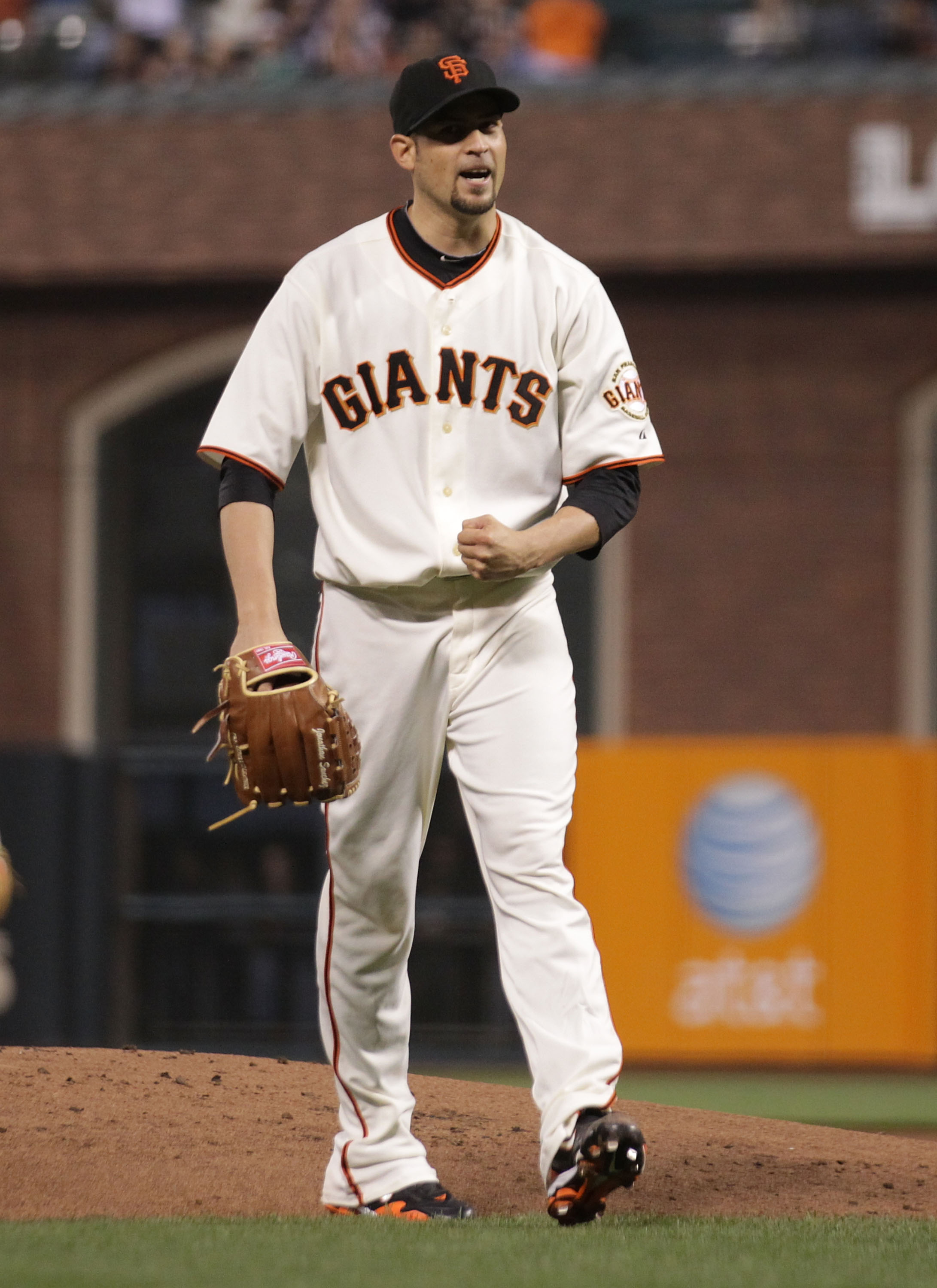 SAN FRANCISCO - SEPTEMBER 16:  Jonathan Sanchez #57 of the San Francisco Giants celebrates at the end of the first inning against the Los Angeles Dodgers during a Major League Baseball game at AT&T Park on September 16, 2010 in San Francisco, California.