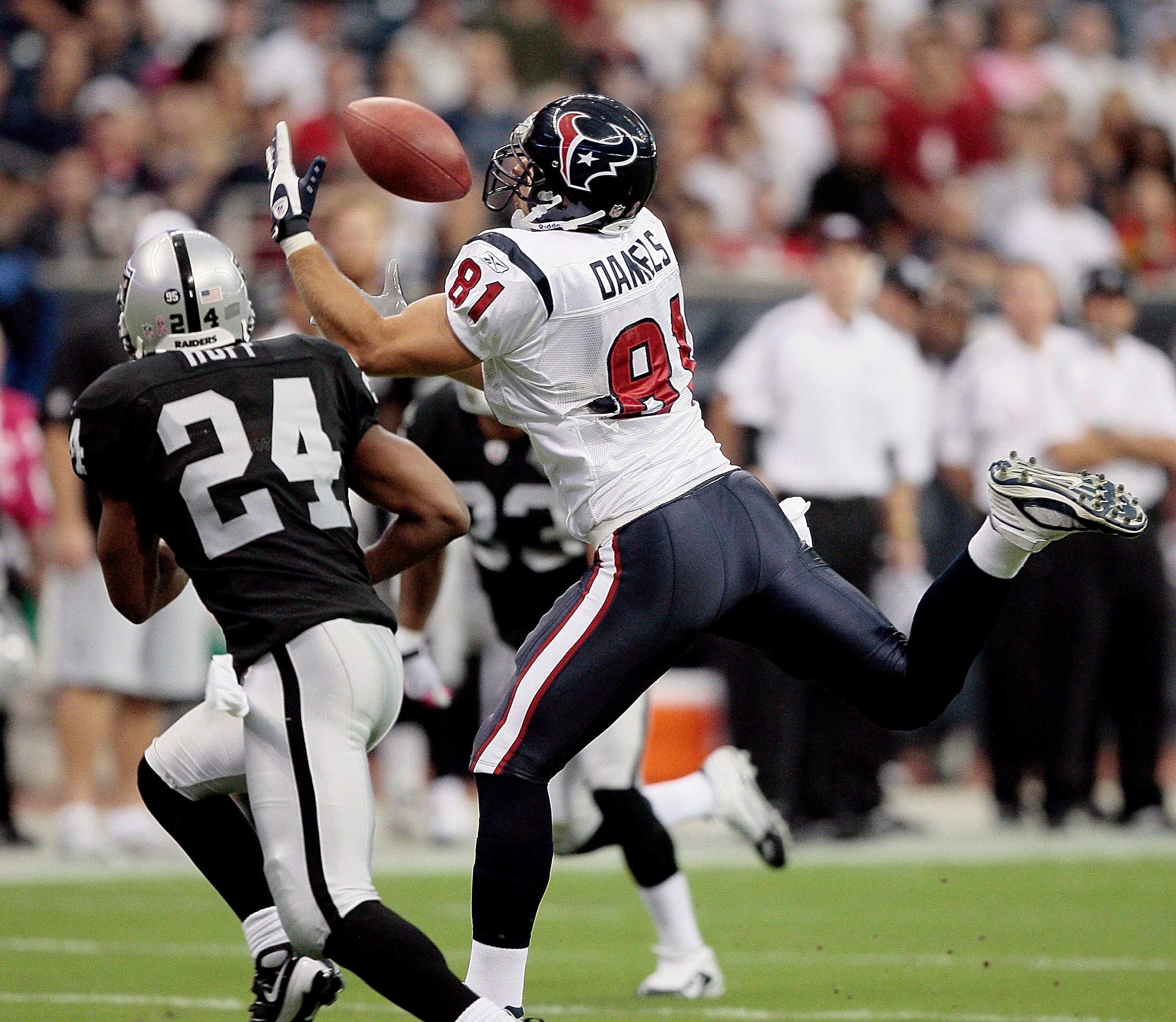 HOUSTON - OCTOBER 04:  Tight-end Owen Daniels #81 of the Houston Texans can't make the catch as he is defended by safety Michael Huff #24 of the Oakland Raiders at Reliant Stadium on October 4, 2009 in Houston, Texas.  (Photo by Bob Levey/Getty Images)