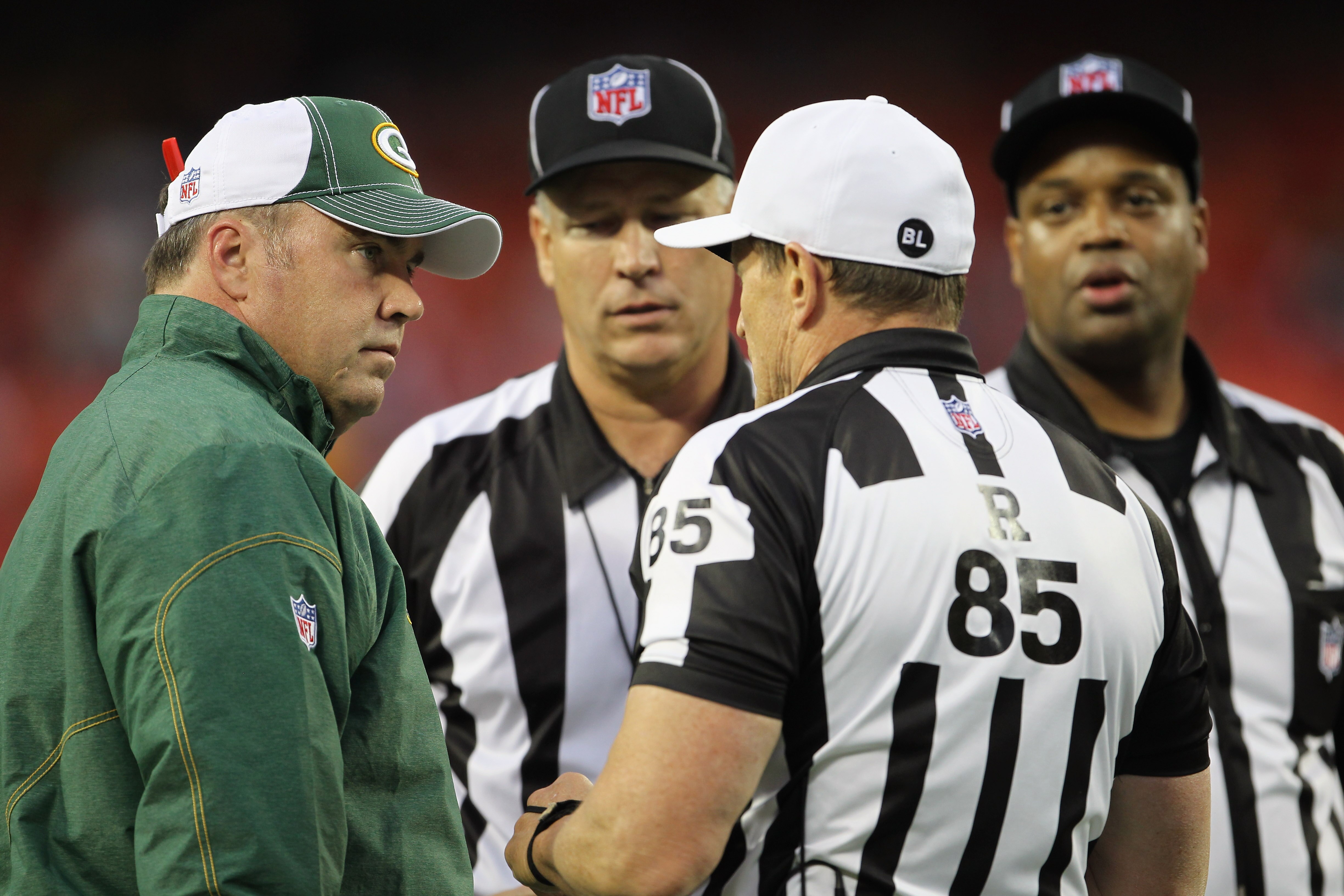 KANSAS CITY, MO - SEPTEMBER 02:  Head coach Mike McCarthy of the Green Bay Packers confers with officials during a challenge in the game against the Kansas City Chiefs on September 2, 2010 at Arrowhead Stadium in Kansas City, Missouri.  (Photo by Jamie Sq