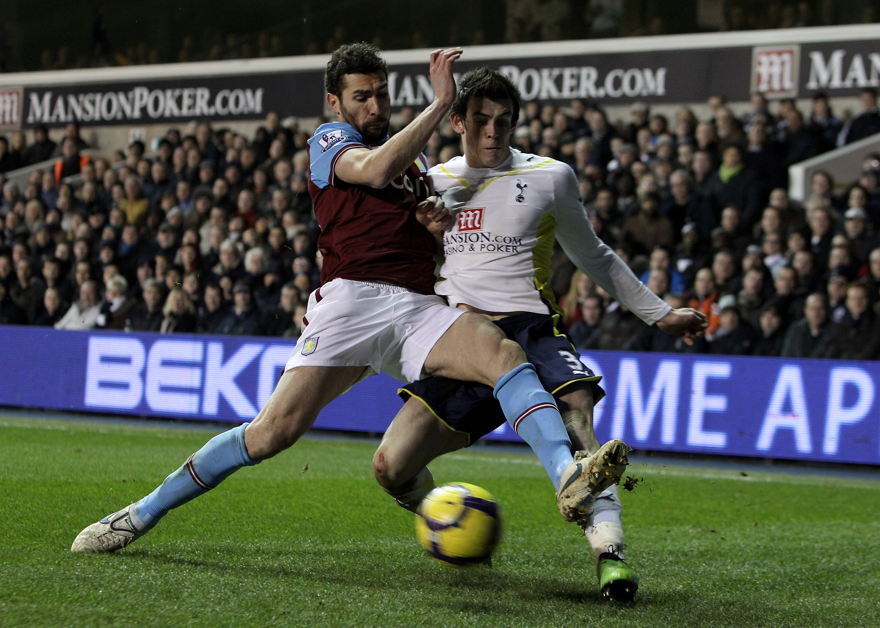 LONDON, ENGLAND - FEBRUARY 06:  Carlos Cuellar of Aston Villa and Gareth Bale of Tottenham Hotspur battle for the ball during the Barclays Premier League match between Tottenham Hotspur and Aston Villa at White Hart Lane on February 6, 2010 in London, Eng