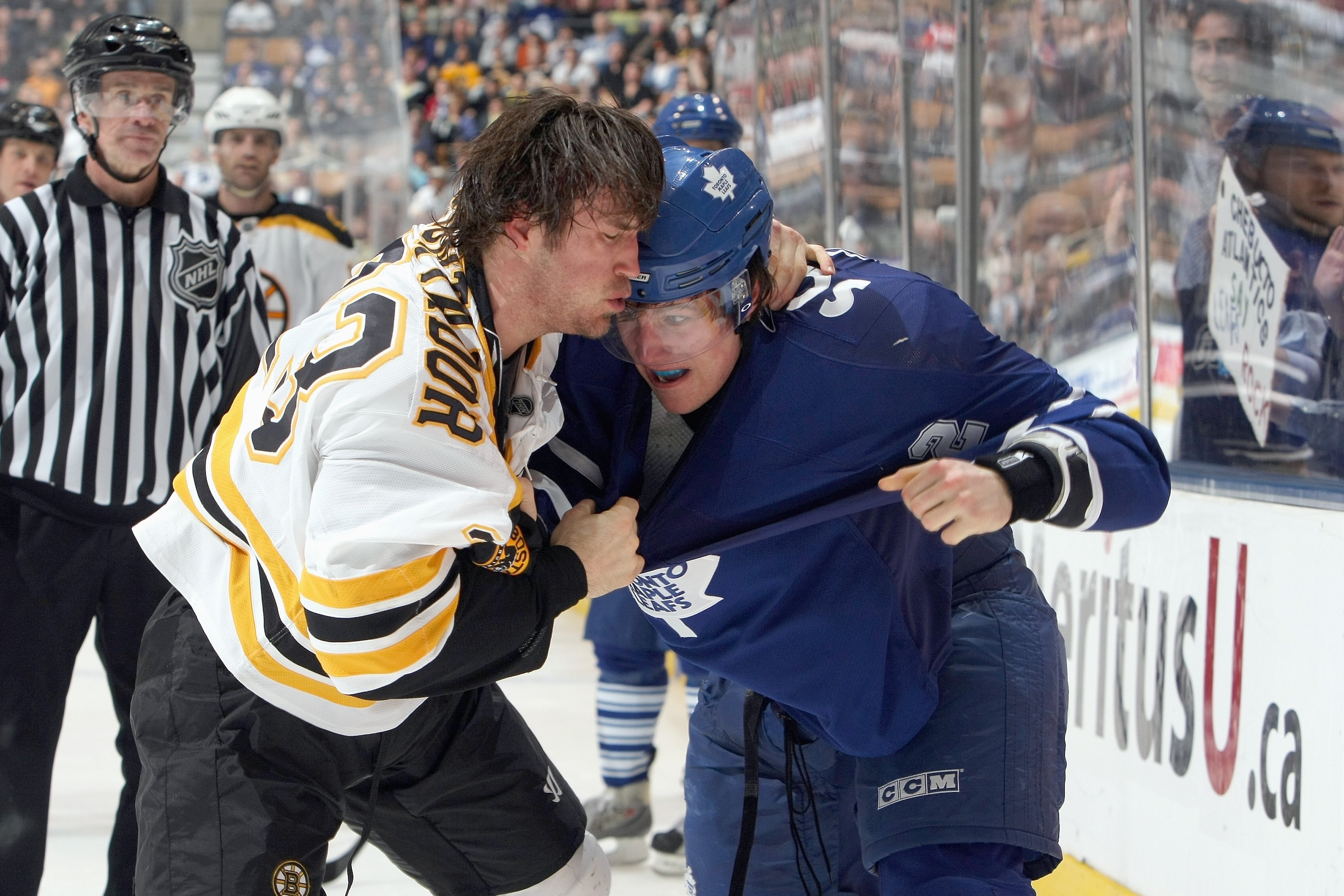 TORONTO - MARCH 28:  Steve Montador #23 of the Boston Bruins fights with Luke Schenn #2 of the Toronto Maple Leafs during the NHL gameat the Air Canada Centre on March 28, 2009 in Toronto, Ontario. (Photo by: Dave Sandford/Getty Images)
